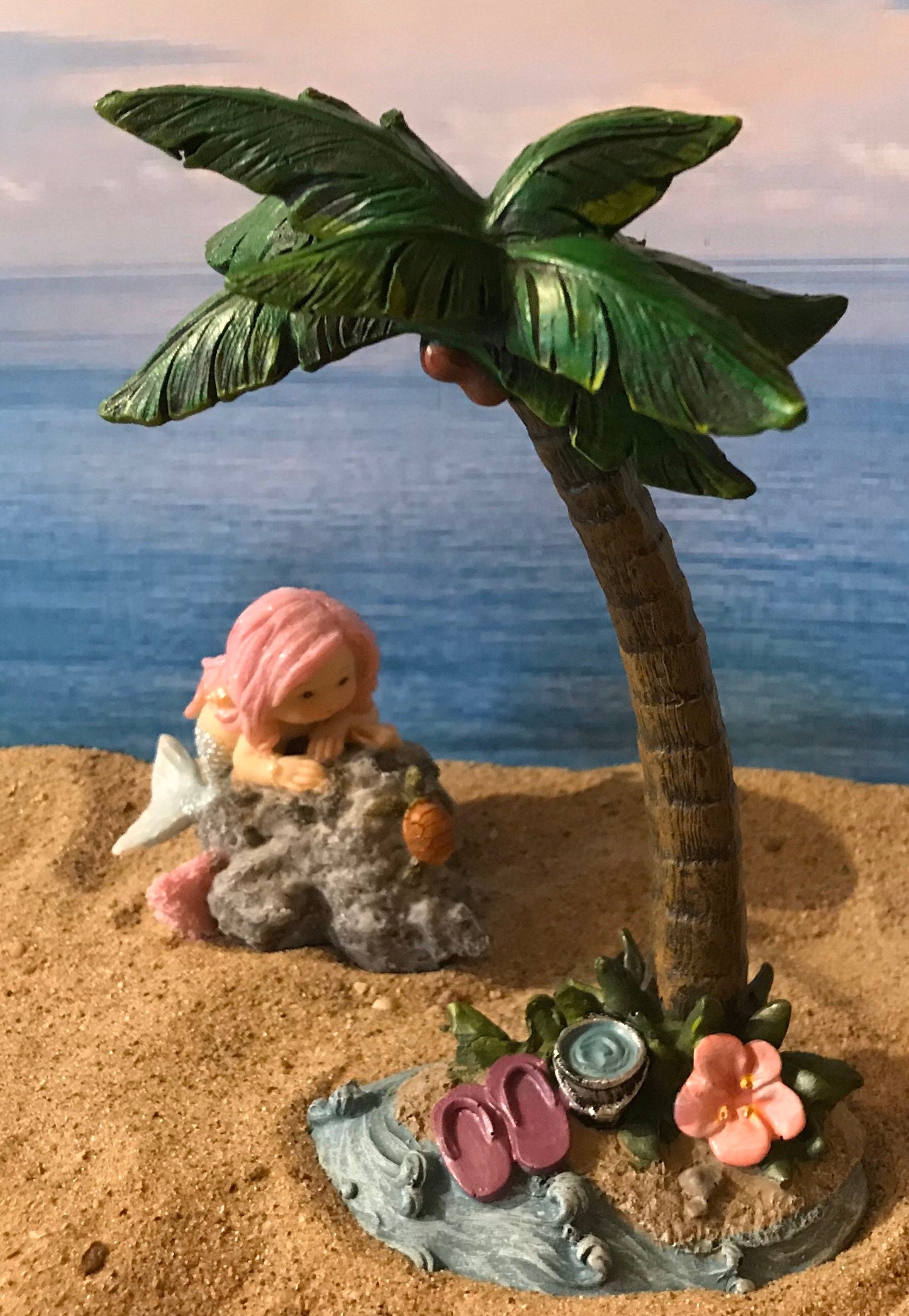 Pretty miniature mermaid playing with turtle on rock fairy garden mermaid with pink flowing hair beach nautical miniature playful mermaid