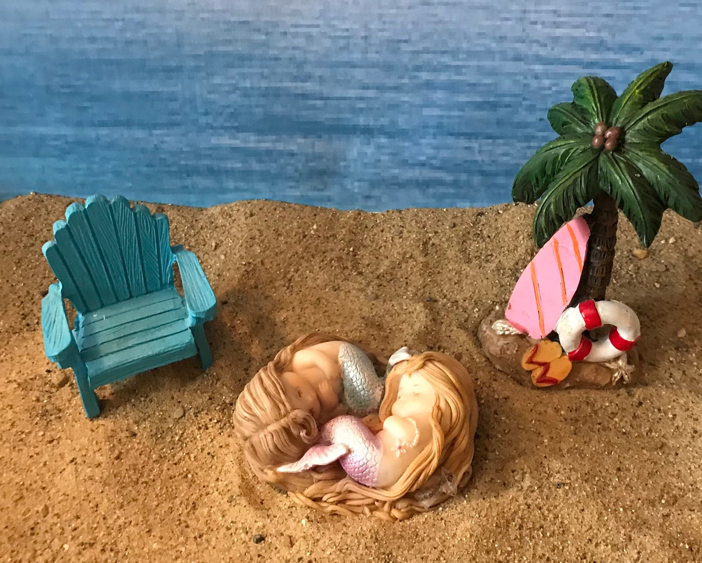Beautiful sleeping mermaids wrapped sweetly in Sleep miniature coastal garden mermaid, miniature beach accessories