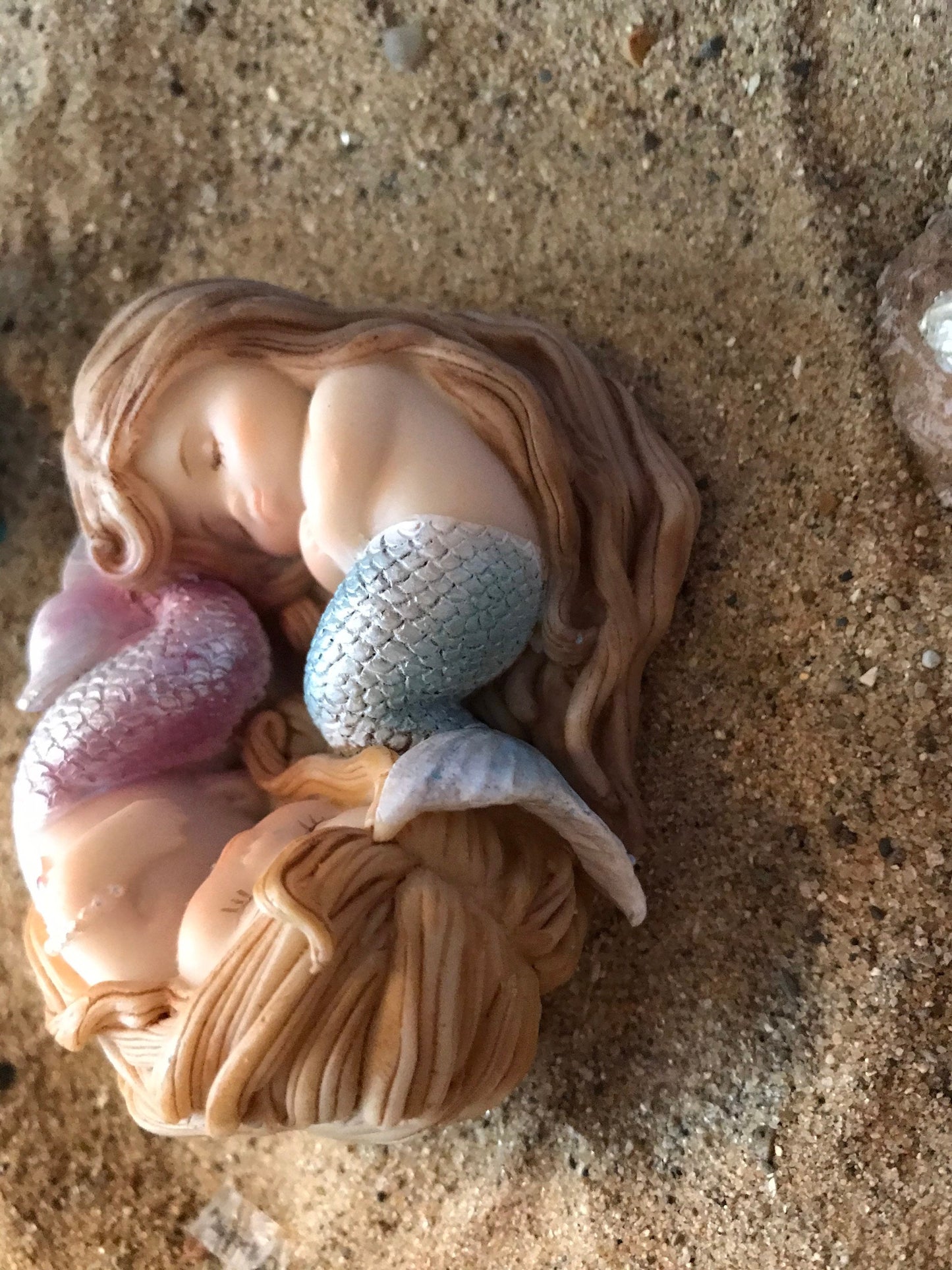 Beautiful sleeping mermaids wrapped sweetly in Sleep miniature coastal garden mermaid, miniature beach accessories