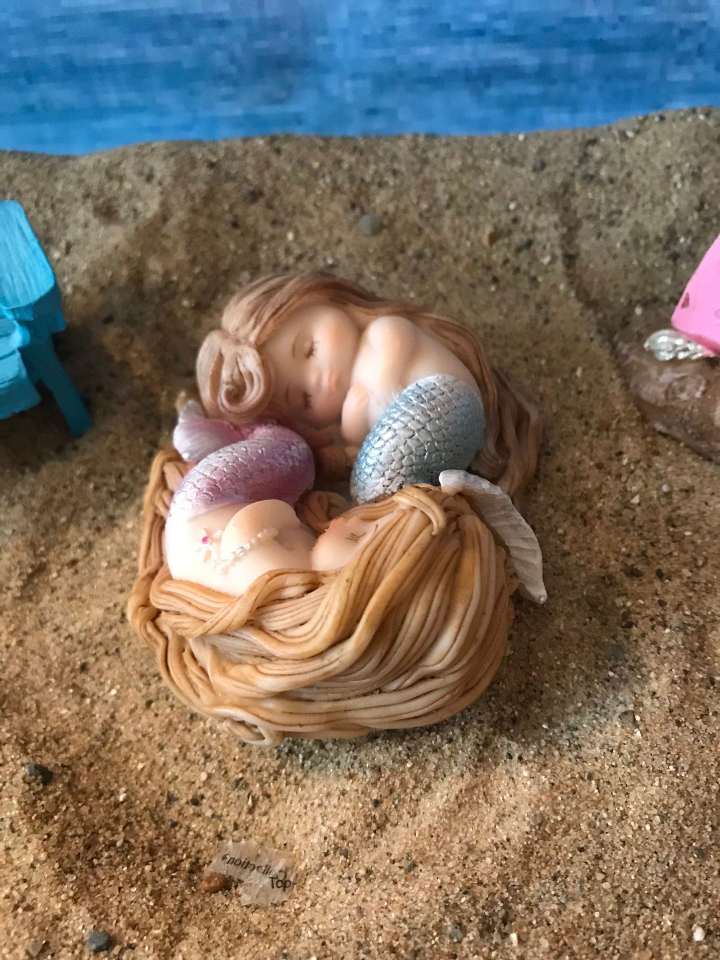 Beautiful sleeping mermaids wrapped sweetly in Sleep miniature coastal garden mermaid, miniature beach accessories