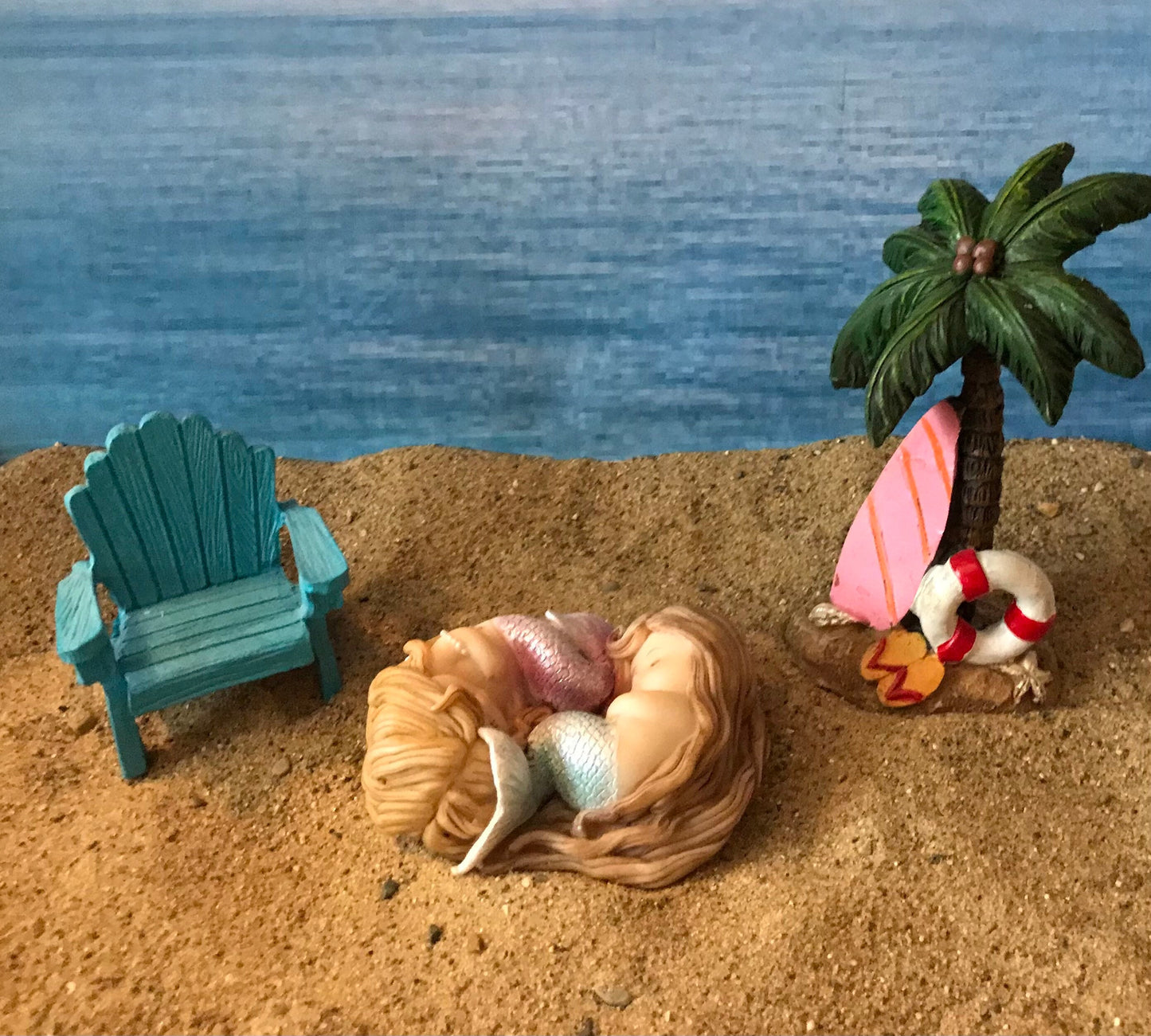 Beautiful sleeping mermaids wrapped sweetly in Sleep miniature coastal garden mermaid, miniature beach accessories