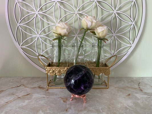 Rainbow Fluorite Sphere weighs over 1 1/2 pounds