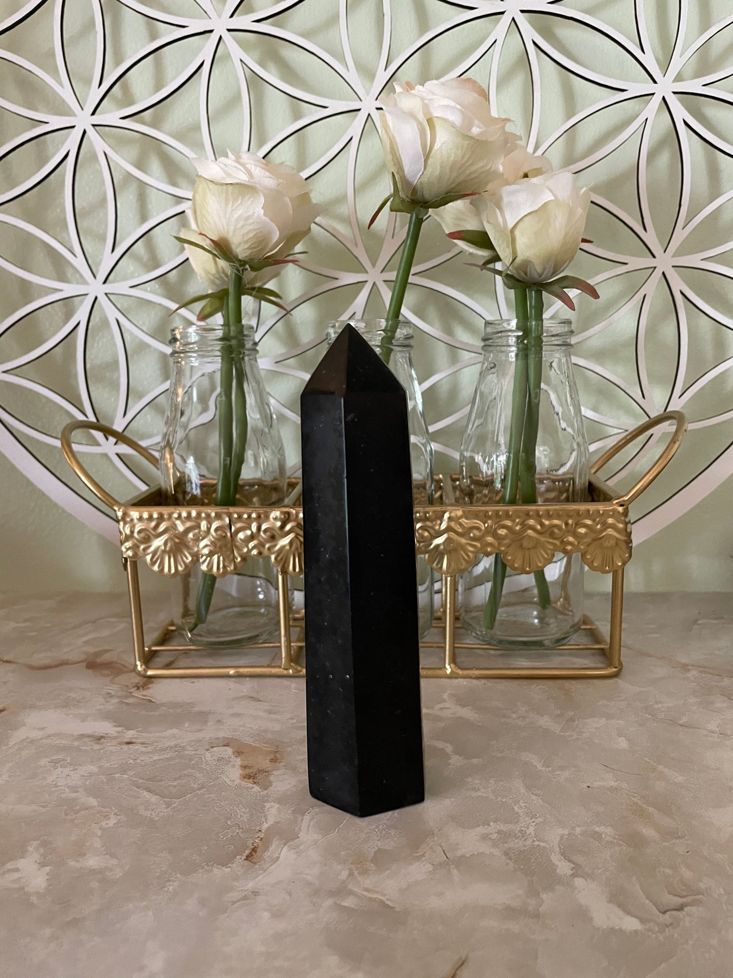 This magnificent Black Tourmaline point is approximately 6” tall and weighs 12.2 ounces.