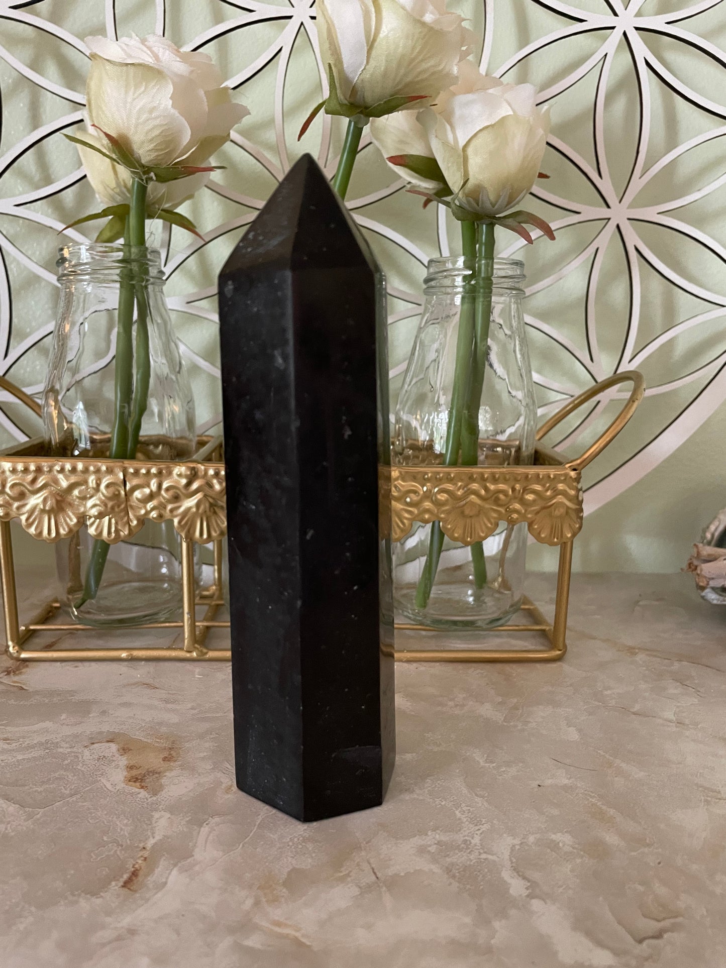 This magnificent Black Tourmaline point is approximately 6” tall and weighs 14.4 ounces.