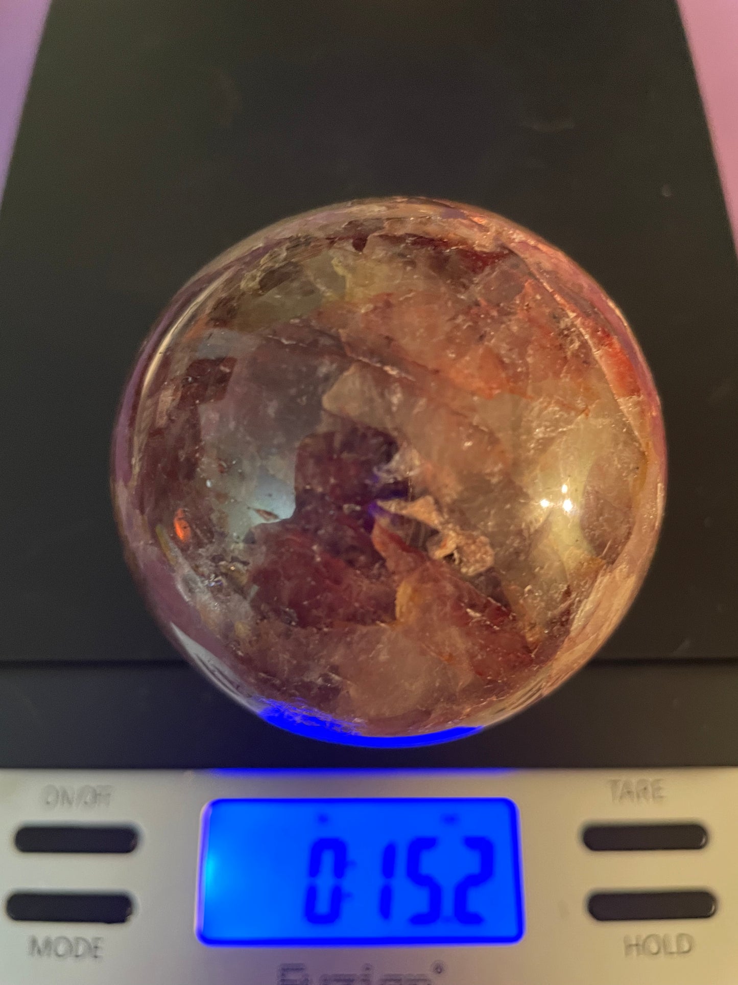 Beautiful specimen of Fire Quartz Sphere weighs just under 1 pound