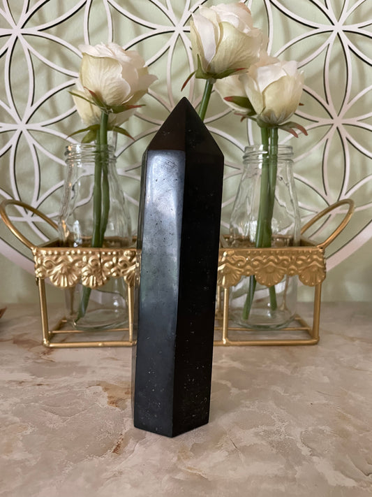 This magnificent Black Tourmaline point is approximately 6” tall and weighs 14.4 ounces.