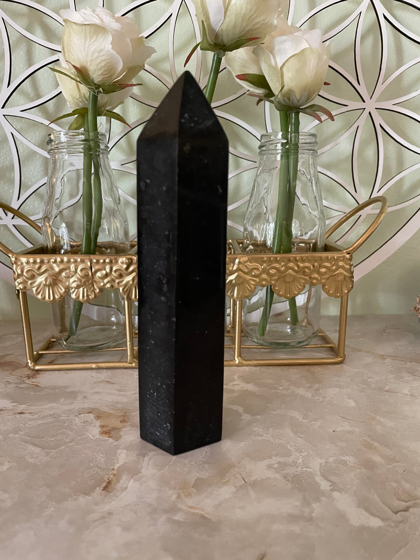 This magnificent Black Tourmaline point is approximately 6” tall and weighs 14.4 ounces.