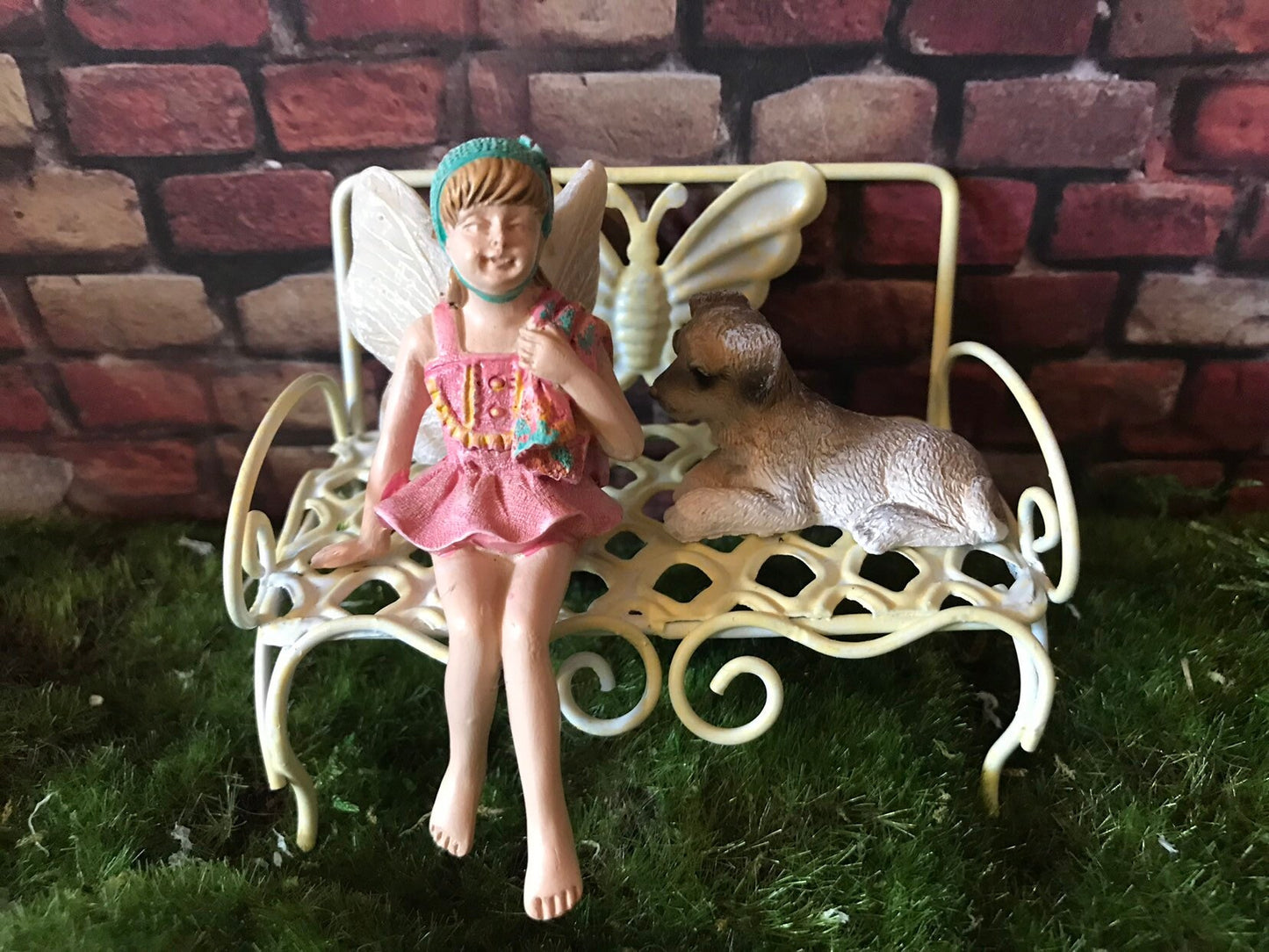 Sweet fairy figurine sitting in swimming suit and ready for summer