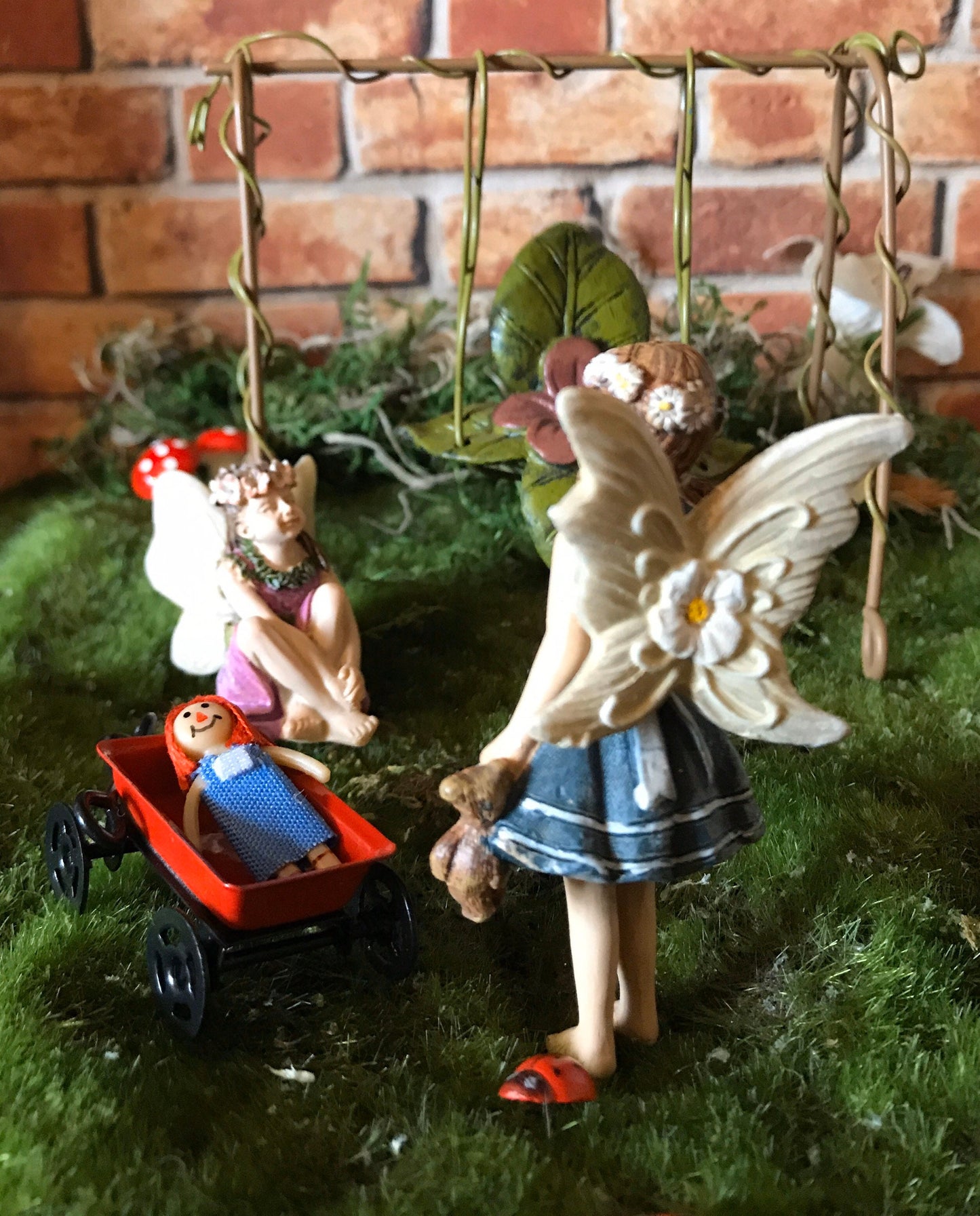 Sweet fairy girl with teddy bear toy