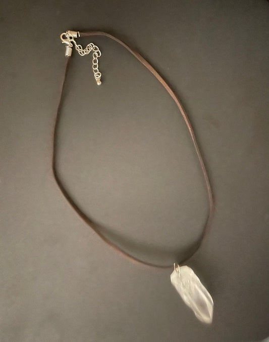 Clear quartz point on 18” brown Swede cord