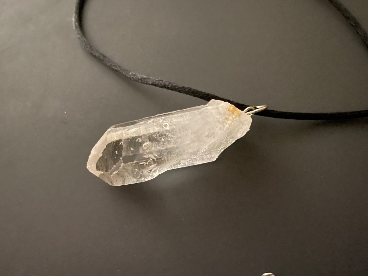 Clear quartz point on 18” black cord