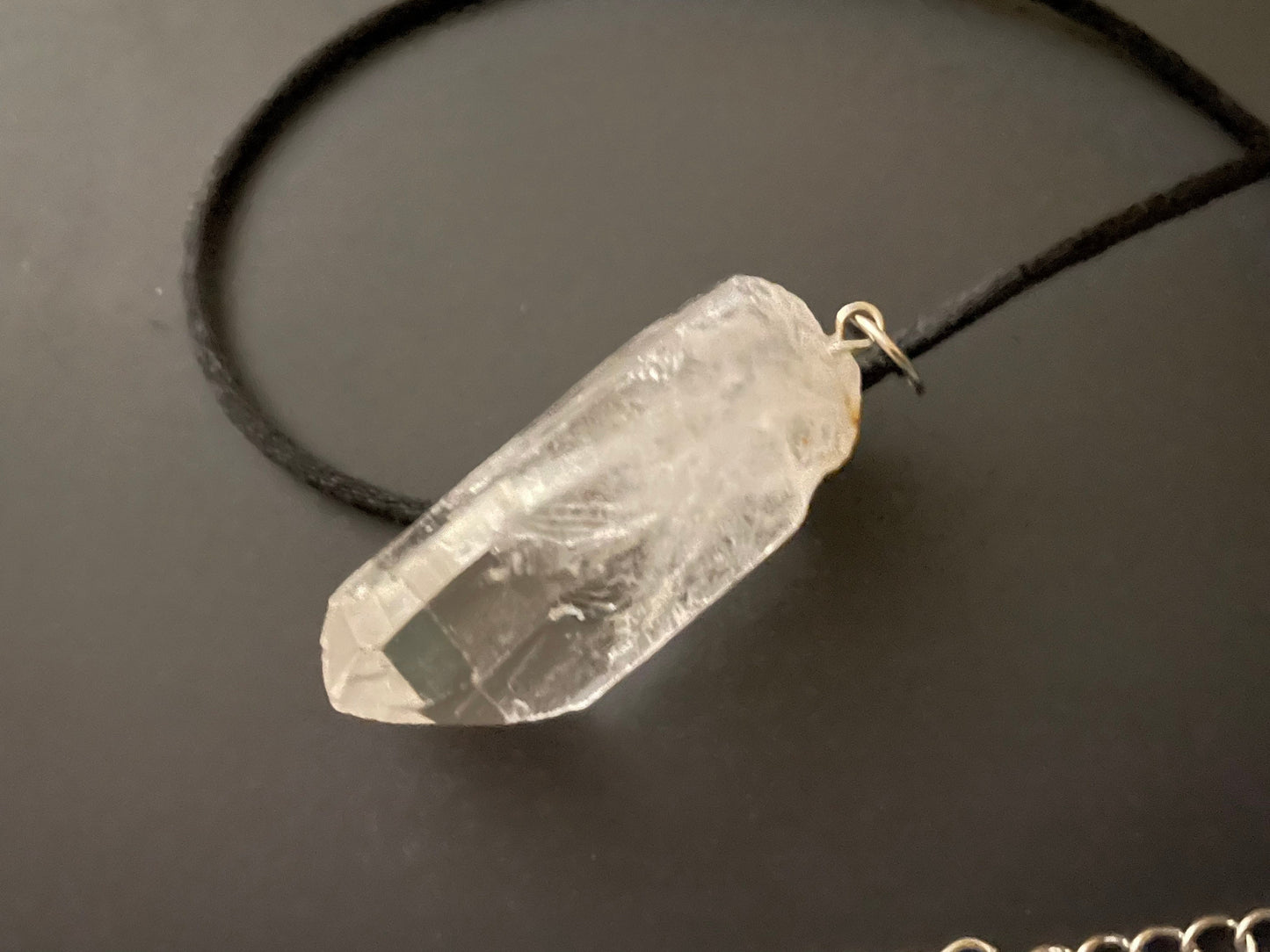 Clear quartz point on 18” black cord