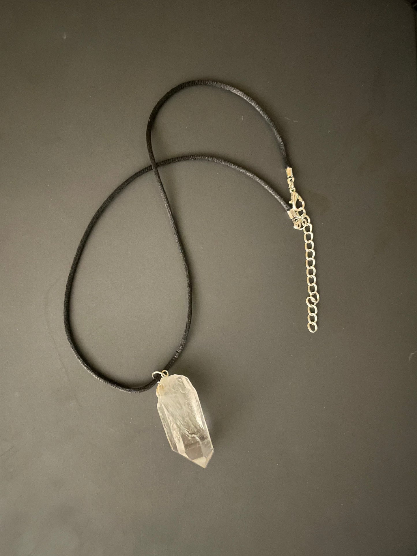 Clear quartz point on 18” black cord