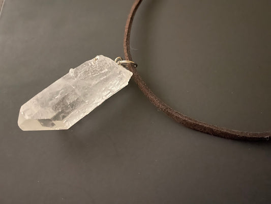 Clear quartz point on 18” brown Swede cord