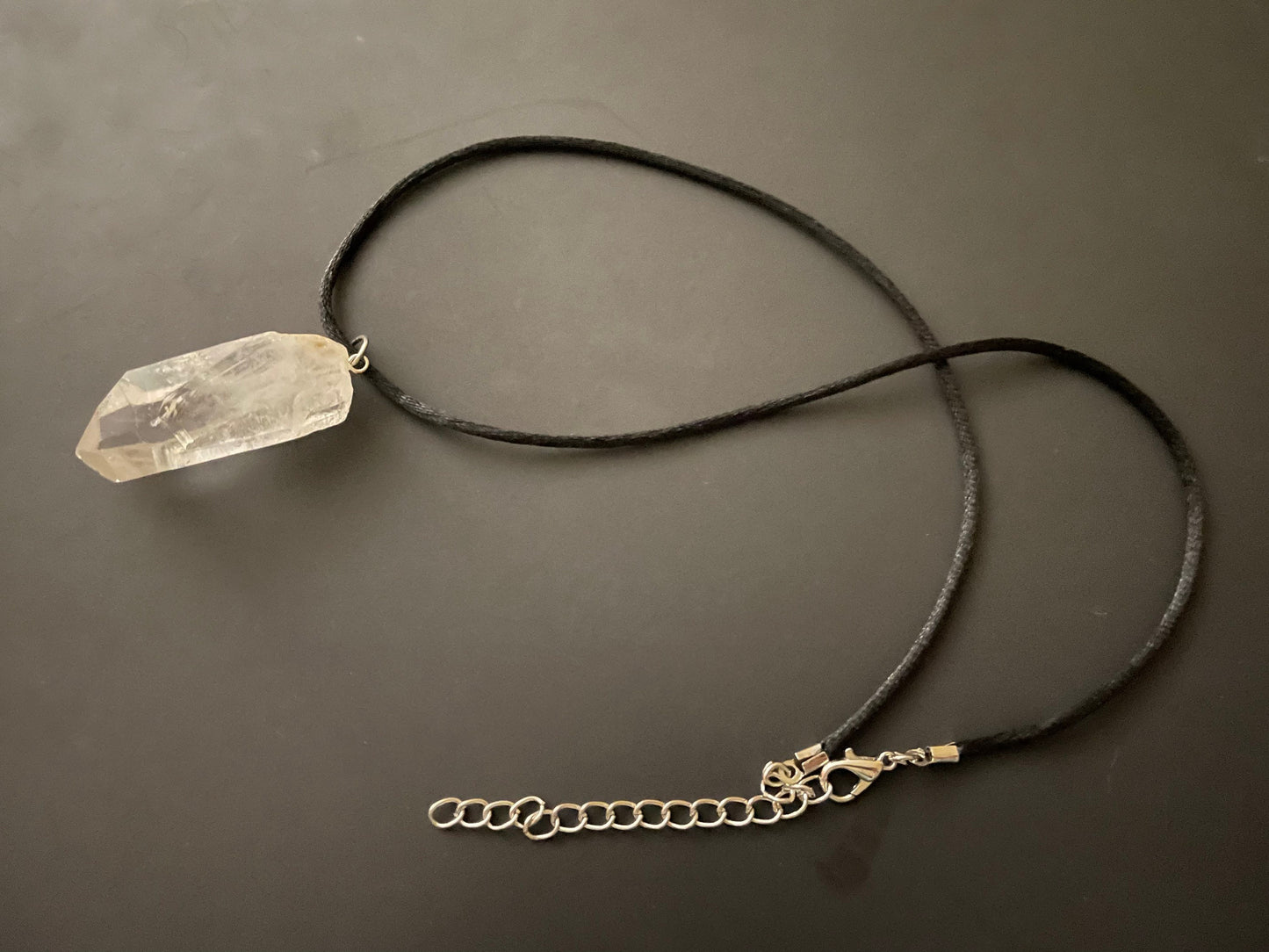 Clear quartz point on 18” black cord