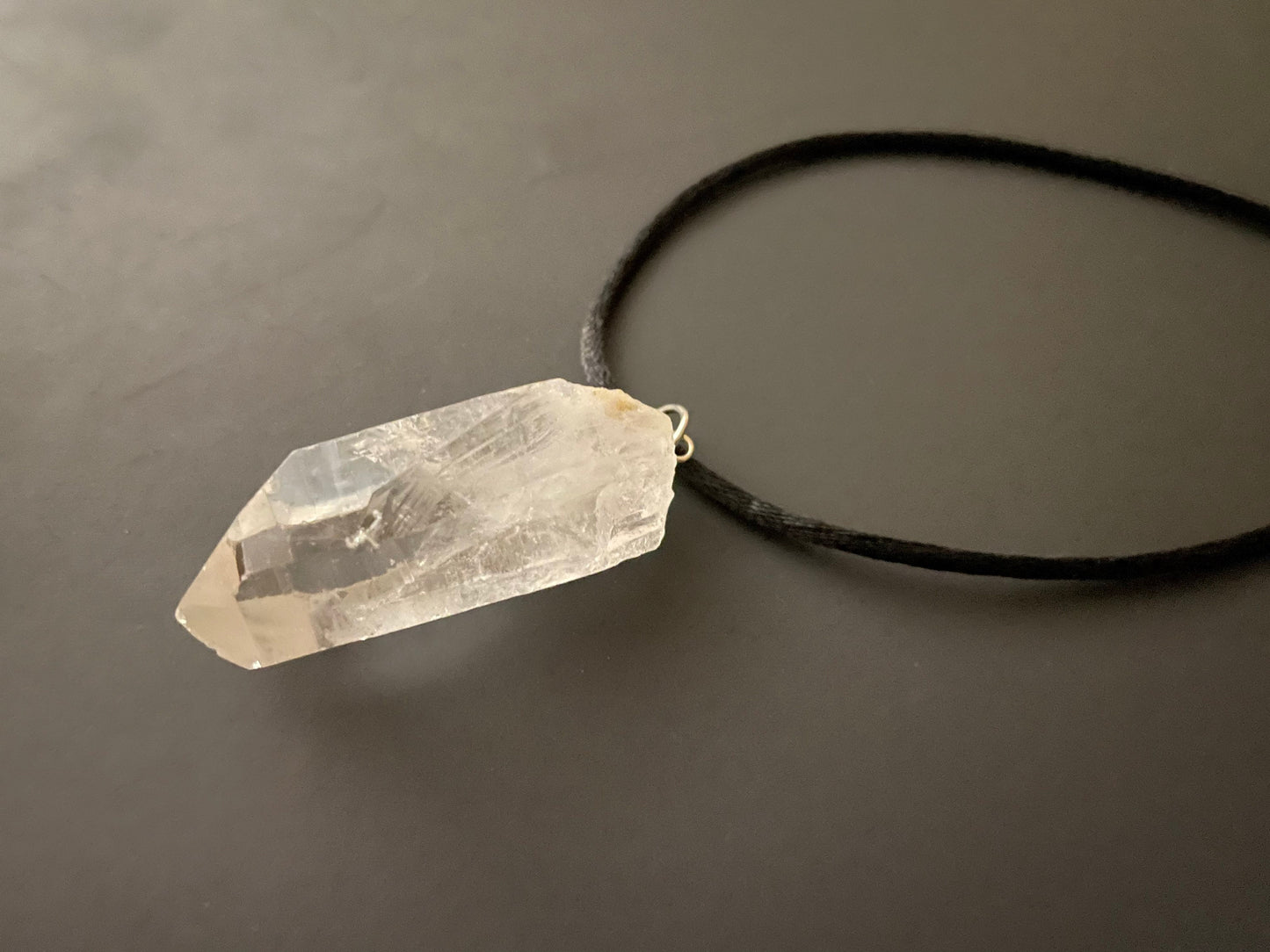 Clear quartz point on 18” black cord