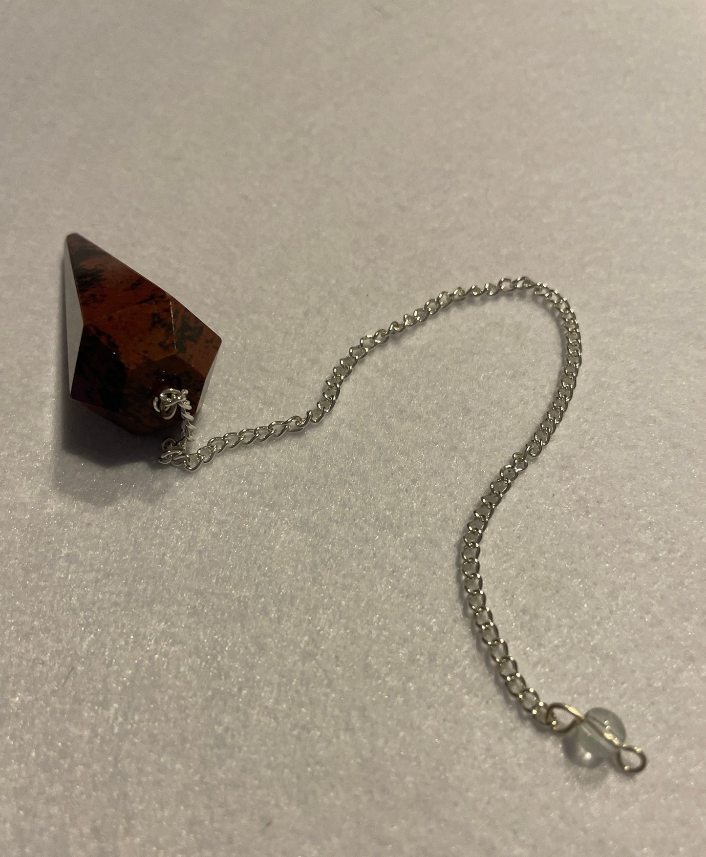 Beautiful Mahogany Obsidian Pendulum 2” stone with chain 9”.