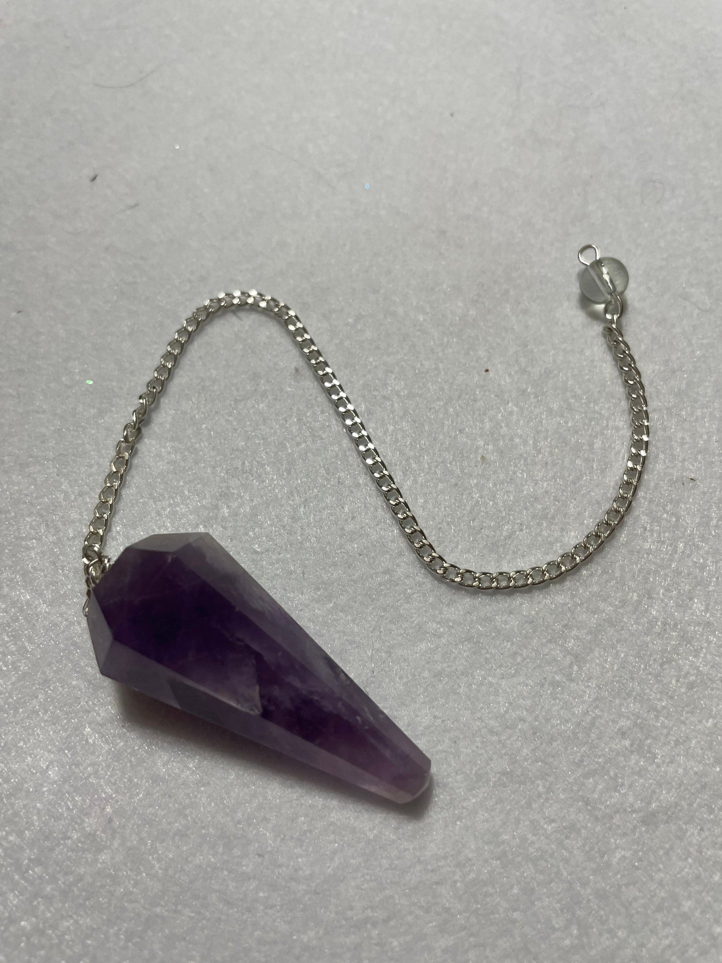 Perfect Amethyst Pendulum is  1.75” and with chain is 9.5”