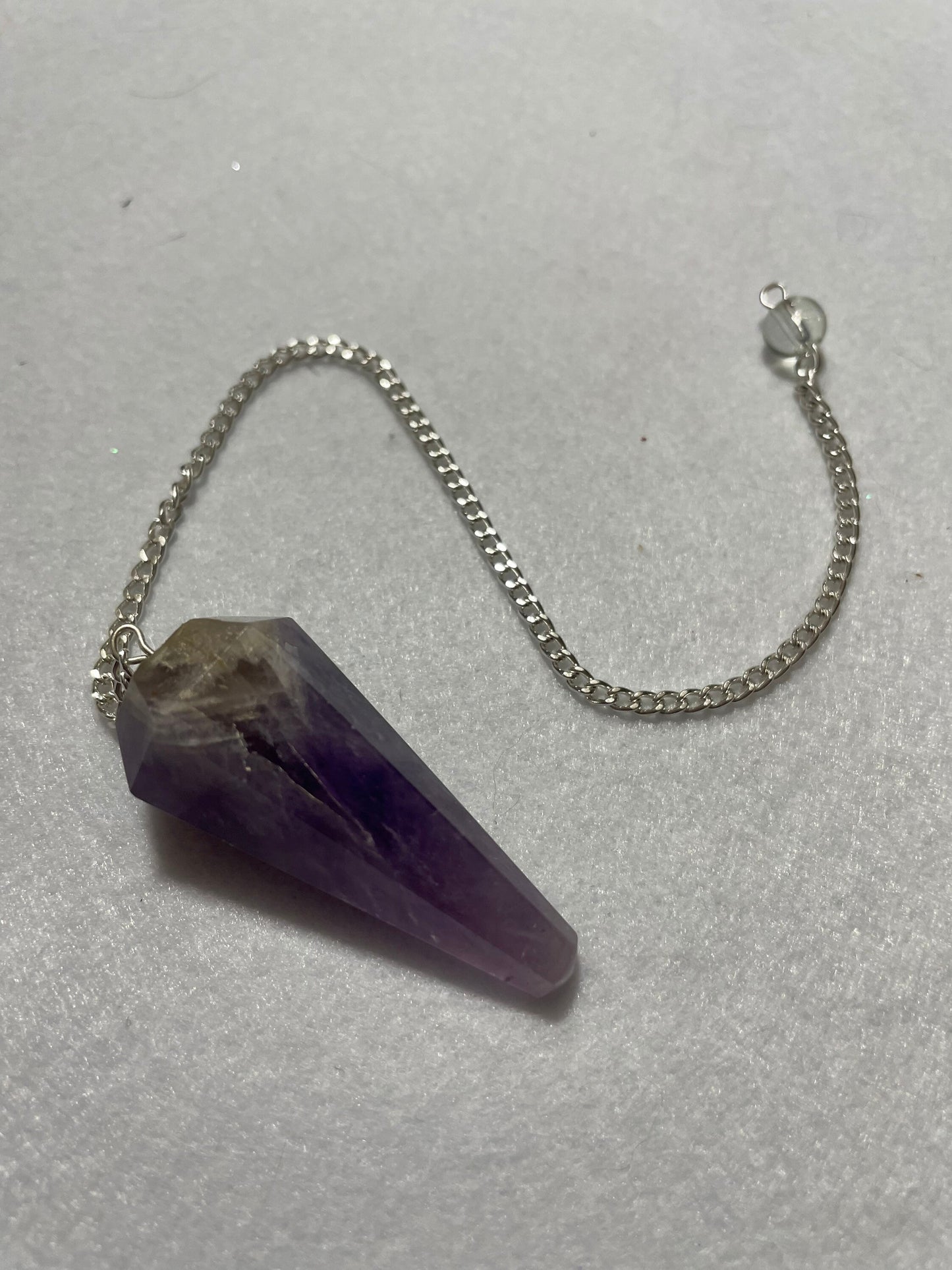 Perfect Amethyst Pendulum is  1.75” and with chain is 9.5”