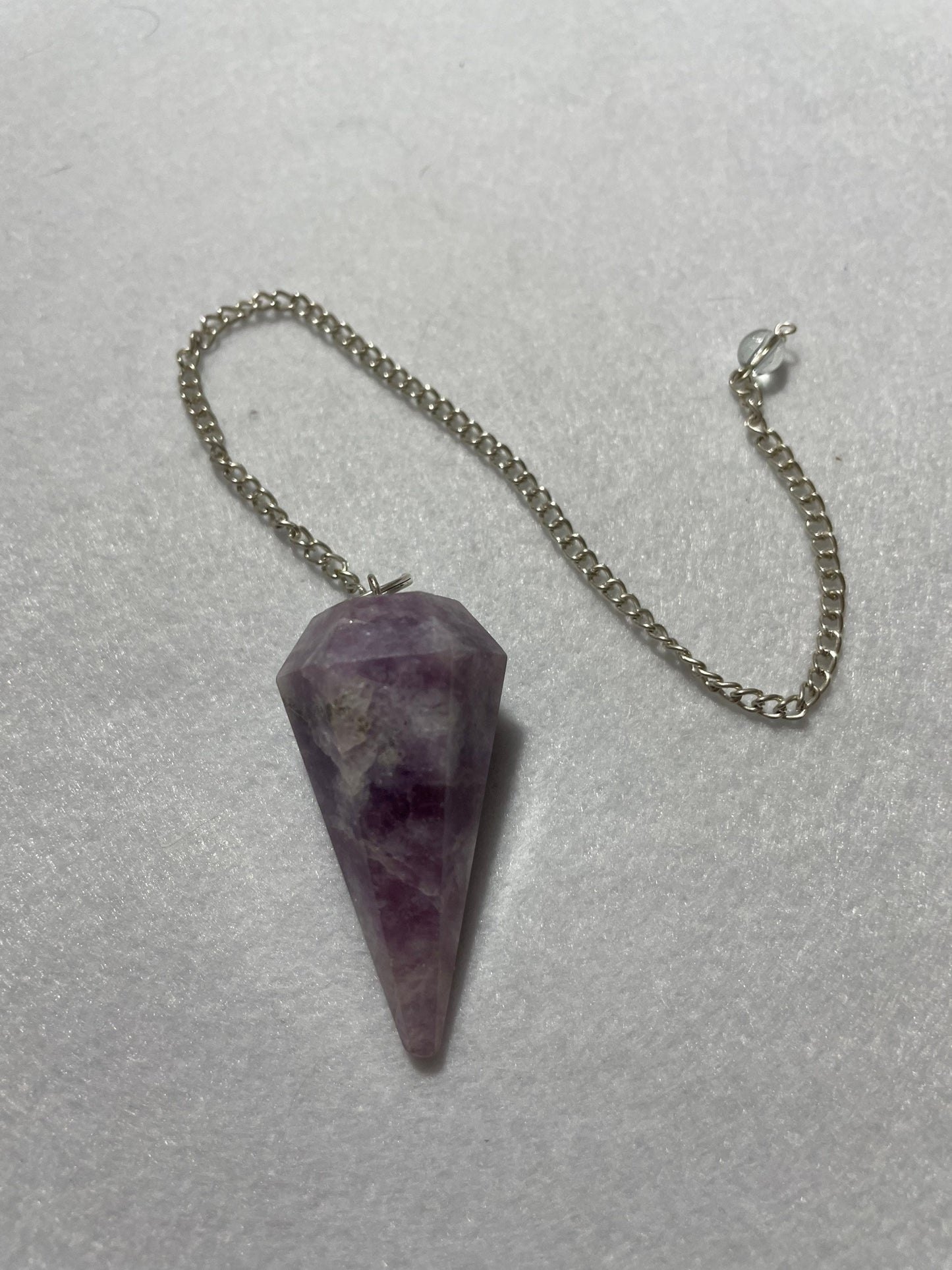 Gorgeous Lepidolite Pendulum is  1.75” and with chain is 9.25”