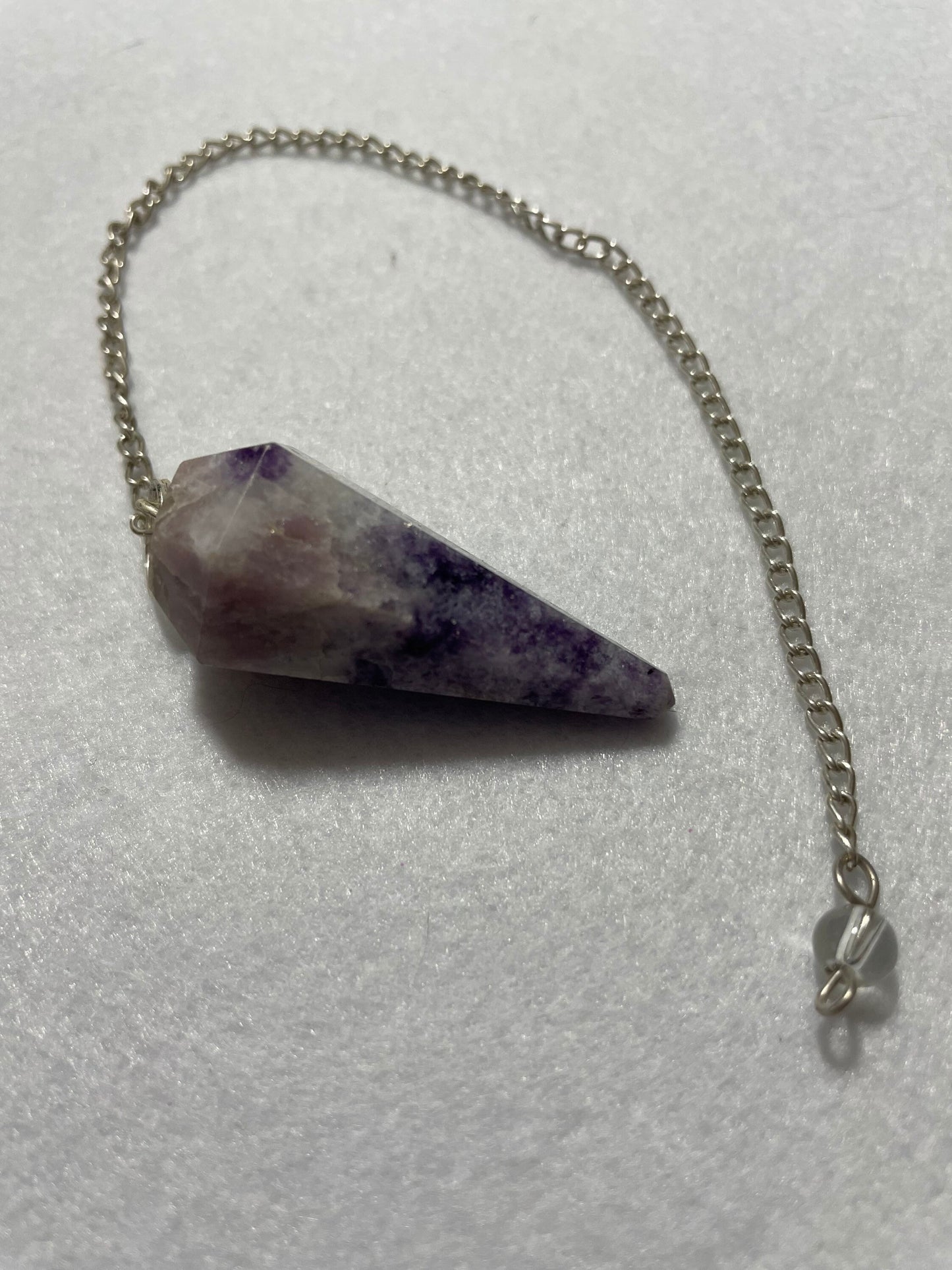 This pretty pink and purple Lepidolite Pendulum is  1.65” and with chain is 9”