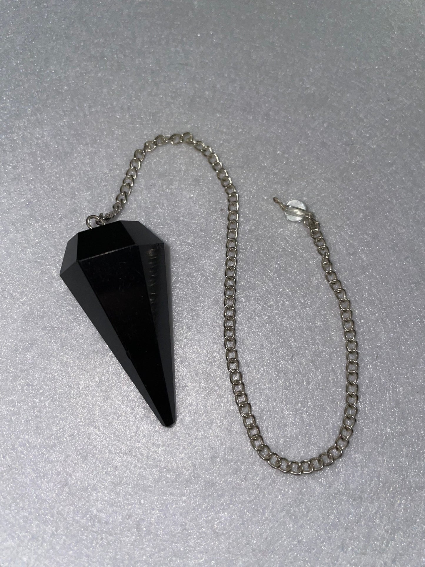 Beautiful Black Obsidian Pendulum is  1.75” and with chain is 9”.25”