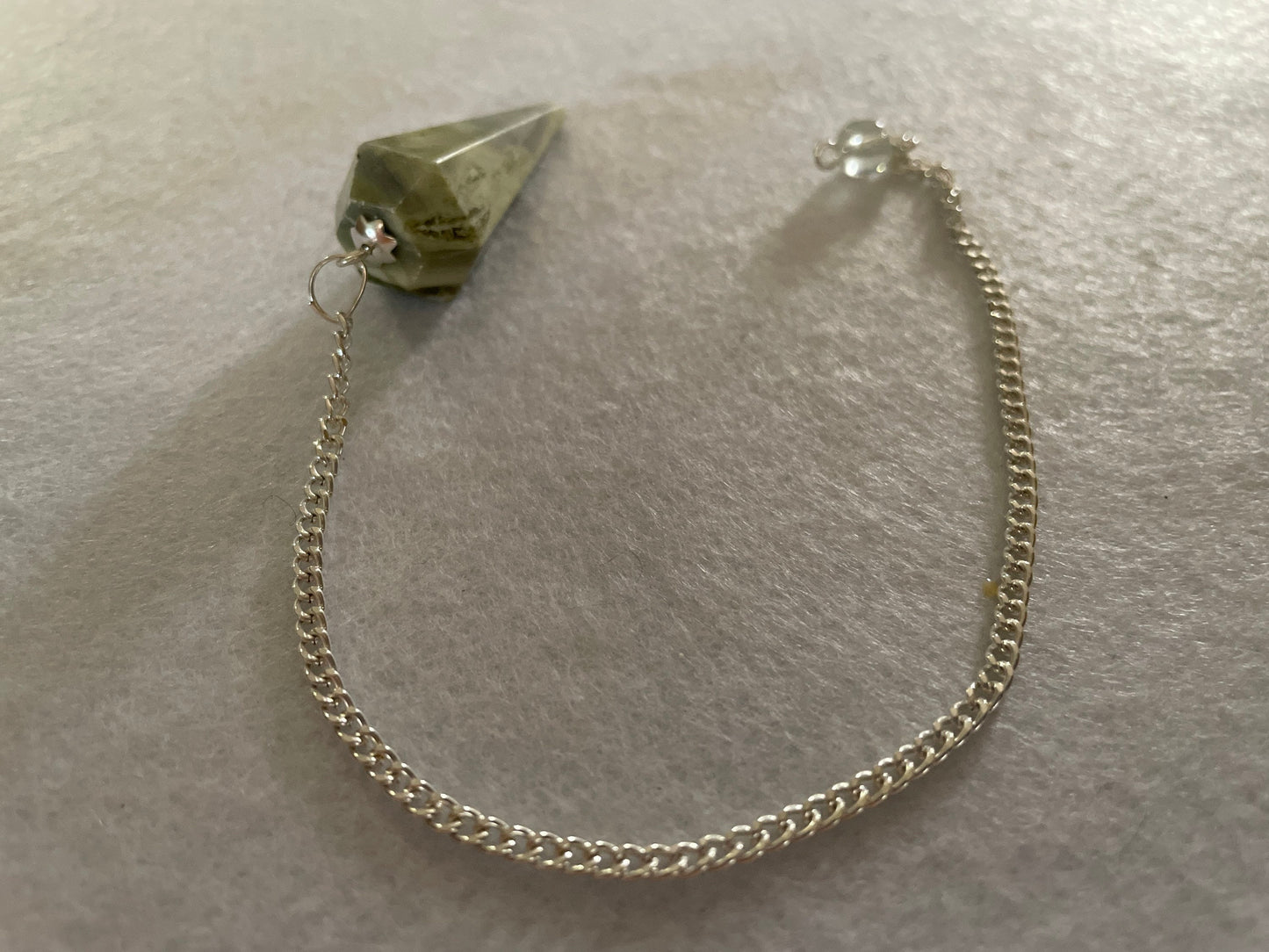Awesome Serpentine Pendulum is  1.65” and with chain is 9.25”