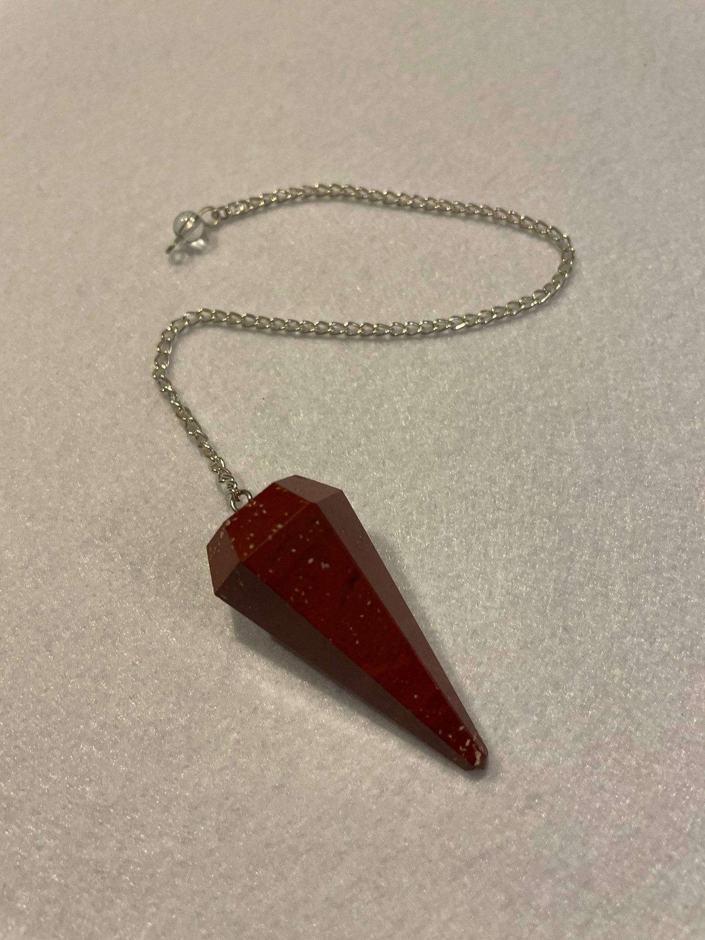 Beautiful Red Jasper Pendulum is 1.75” with chain 9.25”.
