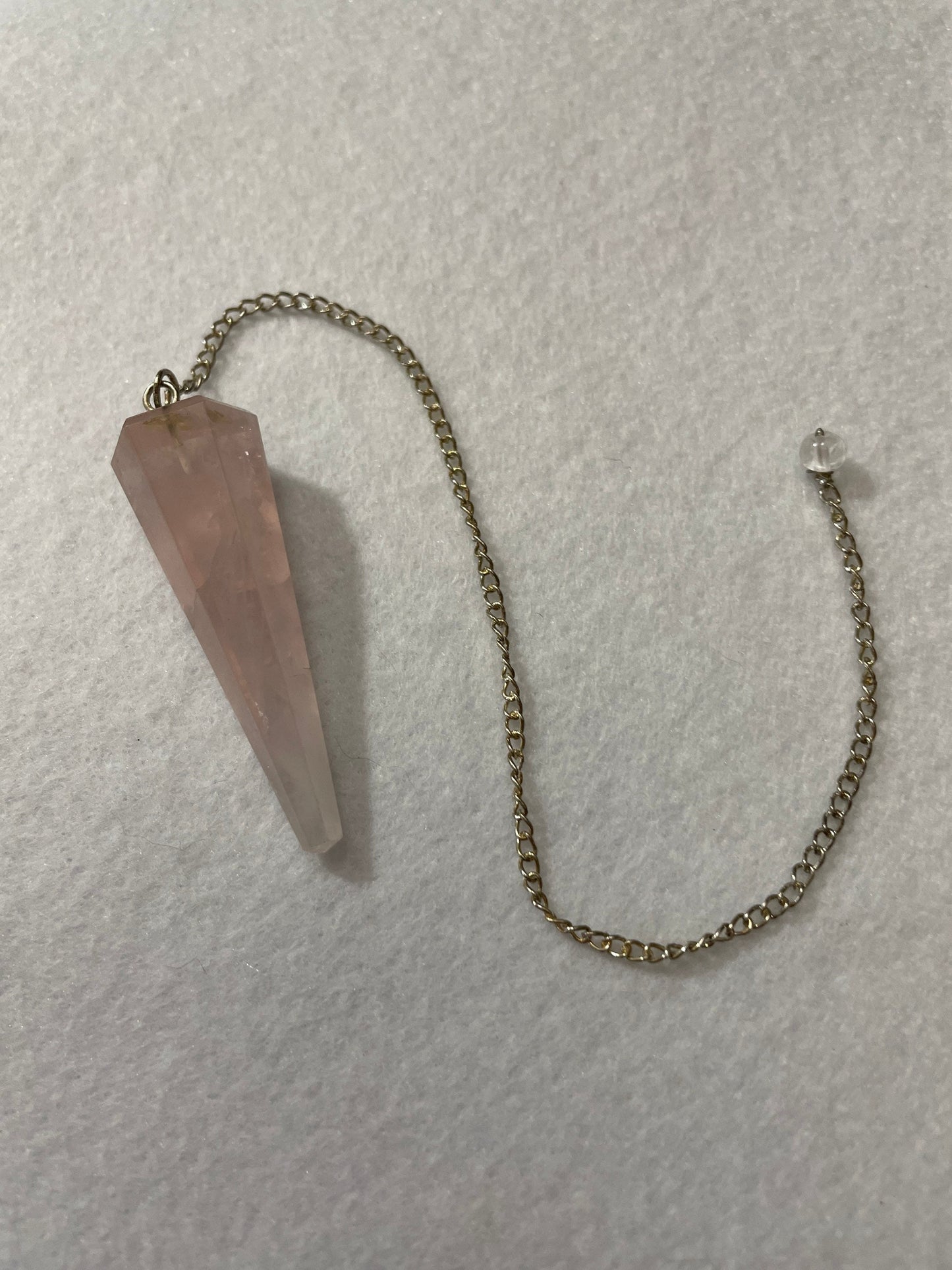 This beautiful Rose Quartz Pendulum is  1.75” and with chain is 8.75”