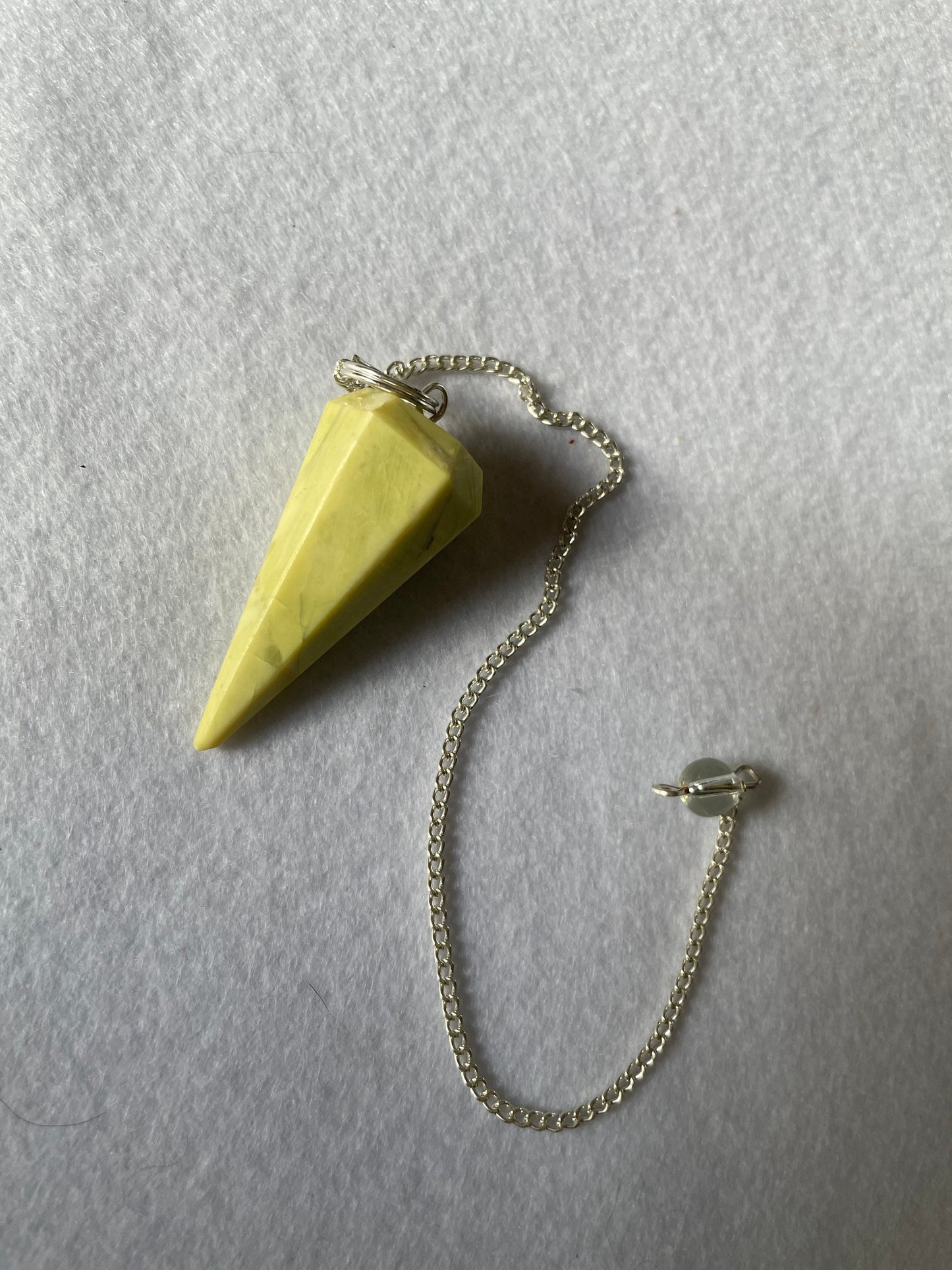 Beautiful Serpentine Pendulum is  1.5” and with chain is 9”.