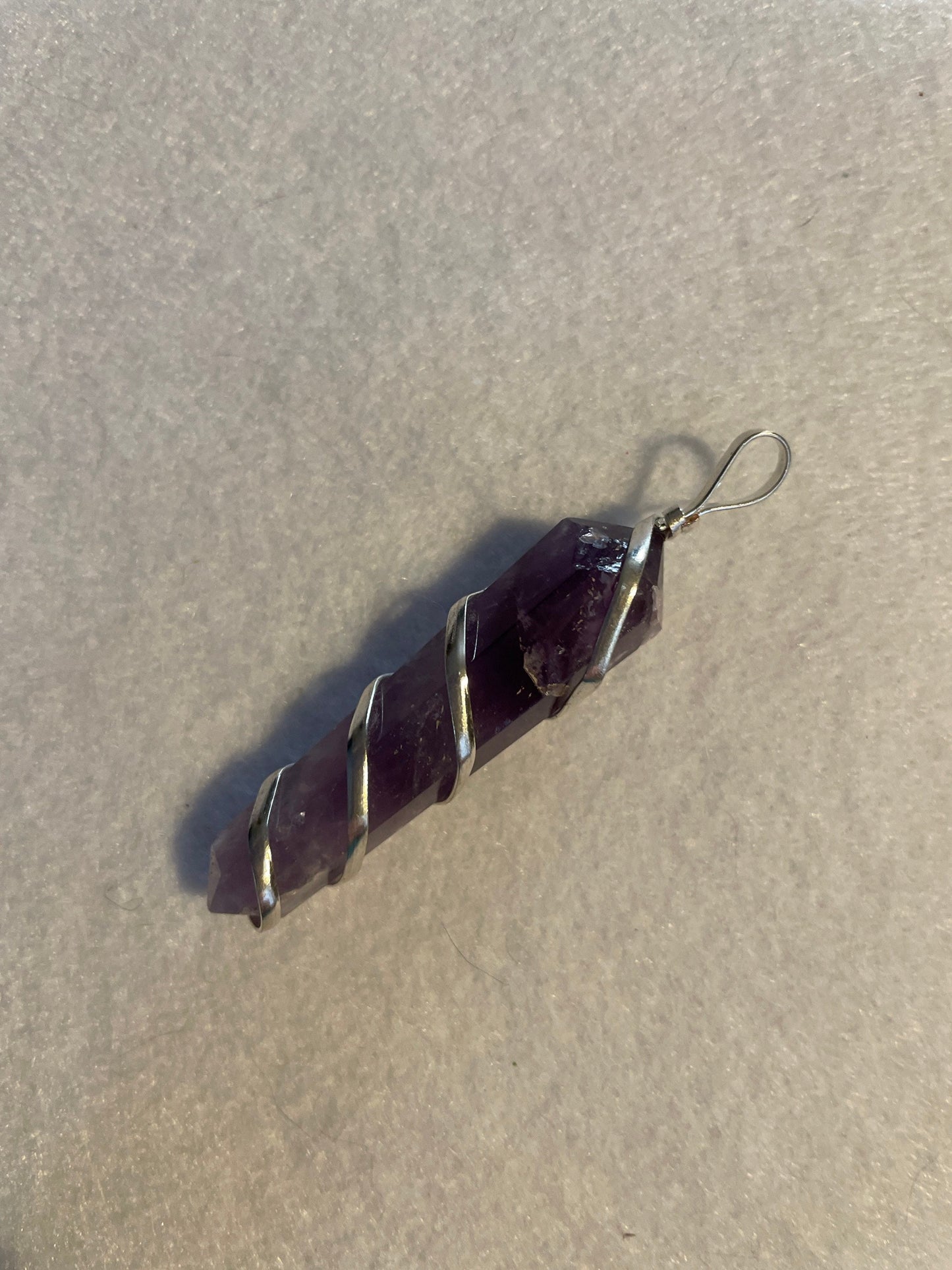 Gorgeous Amethyst point Pendant is almost 2” and is wrapped in precious silver.