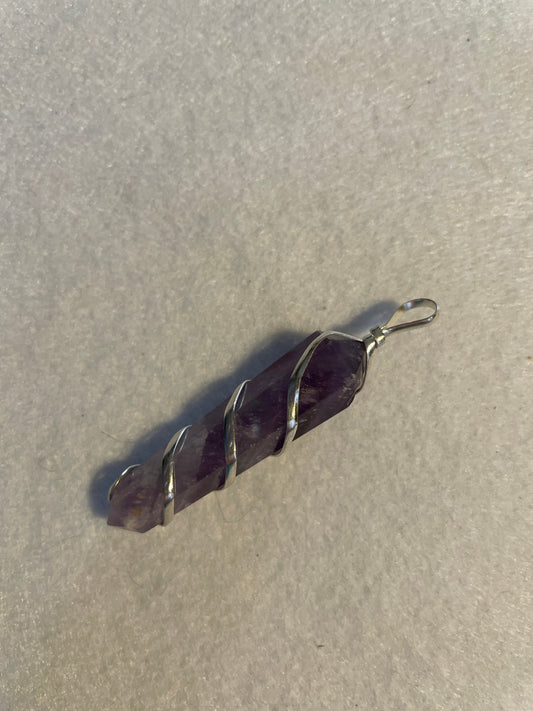 Gorgeous Amethyst point Pendant is almost 2” and is wrapped in precious silver.