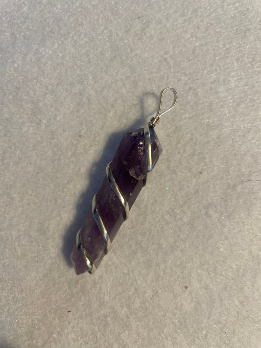 Gorgeous Amethyst point Pendant is almost 2” and is wrapped in precious silver.