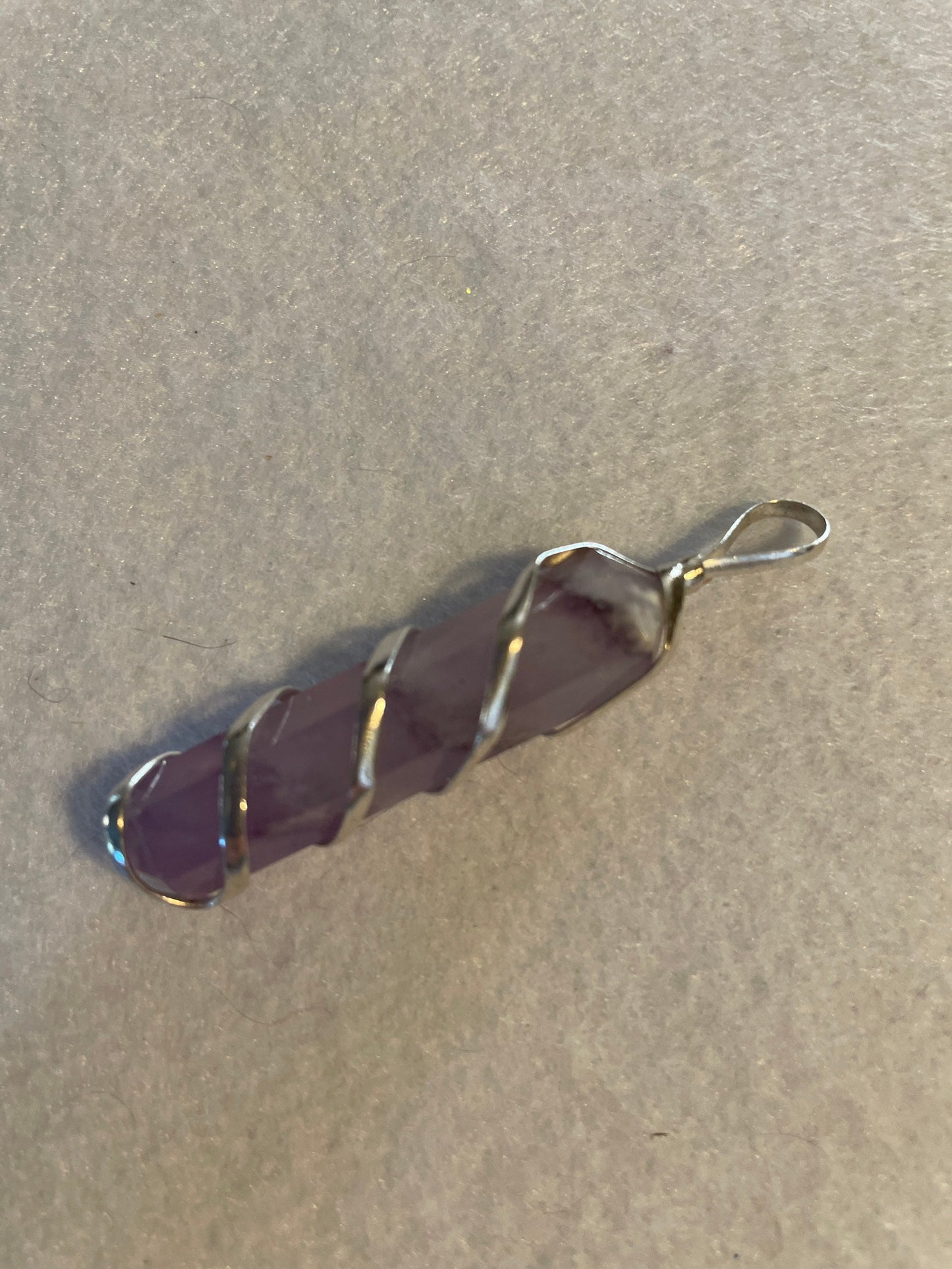 Gorgeous Amethyst Point Pendant is  1.5” and is wrapped in precious silver