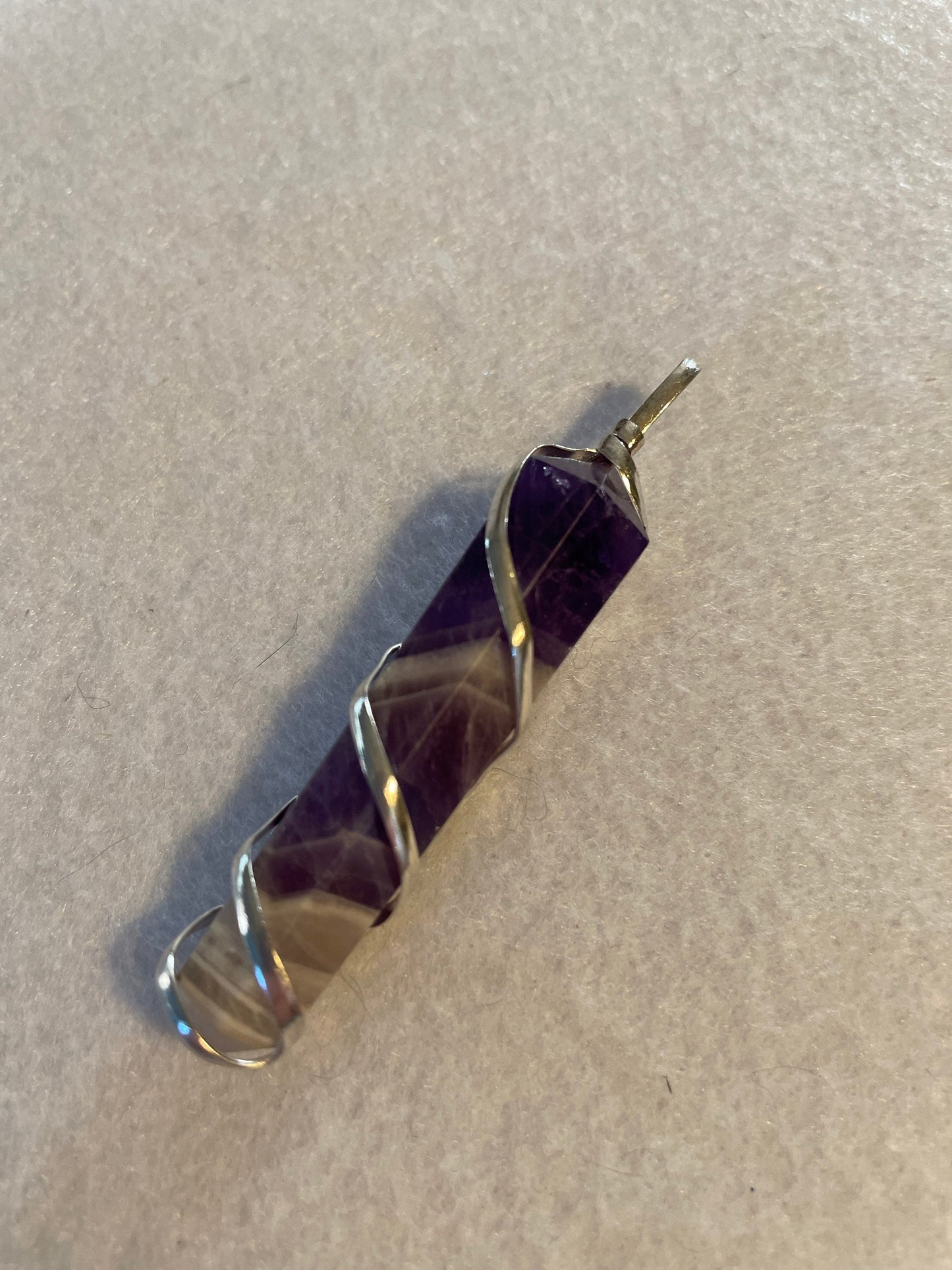 Gorgeous Banded Amethyst Point Pendant is just over 2” and is wrapped in precious silver