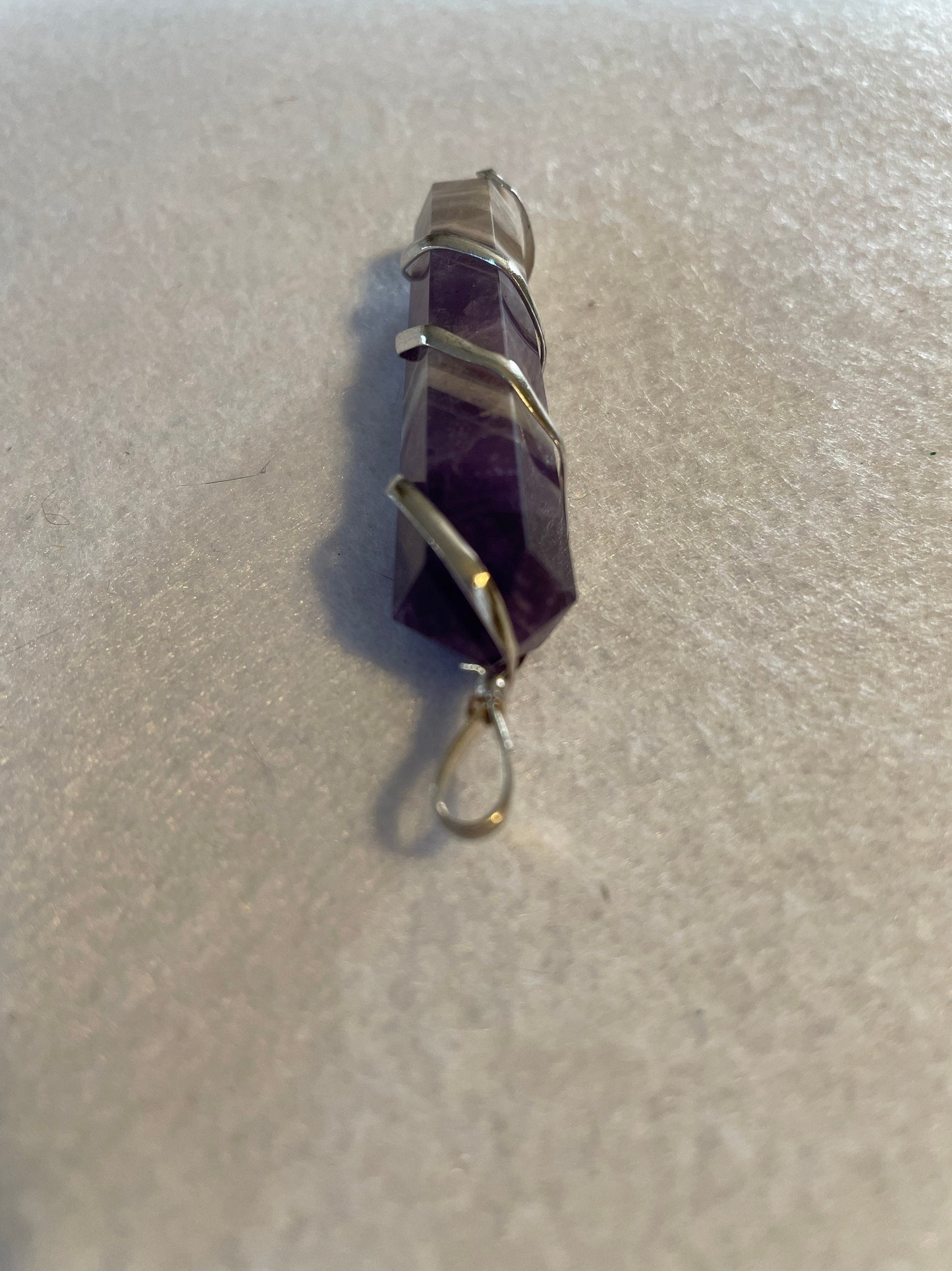 Gorgeous Banded Amethyst Point Pendant is just over 2” and is wrapped in precious silver