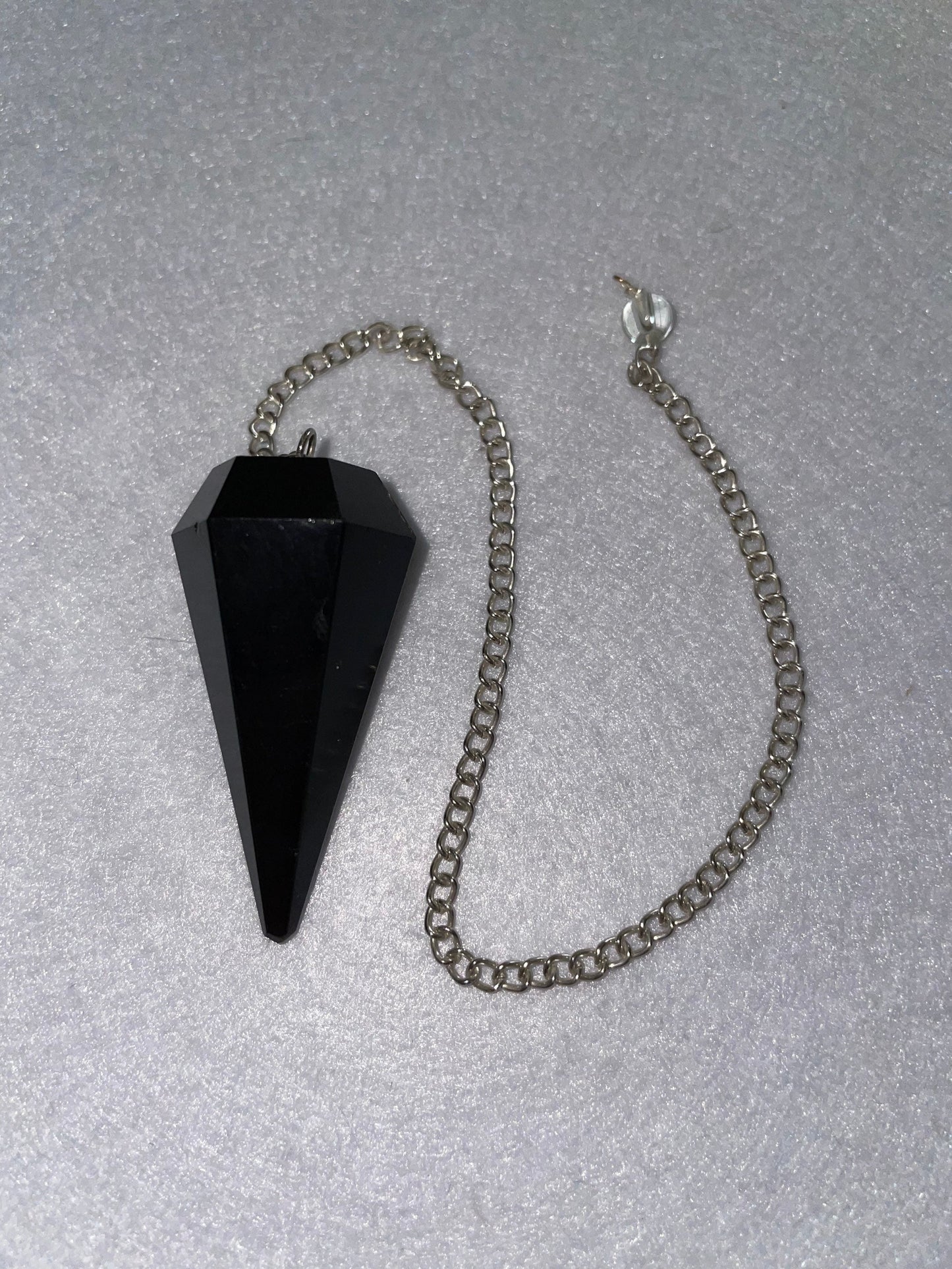 Beautiful Black Obsidian Pendulum is  1.75” and with chain is 9”.25”