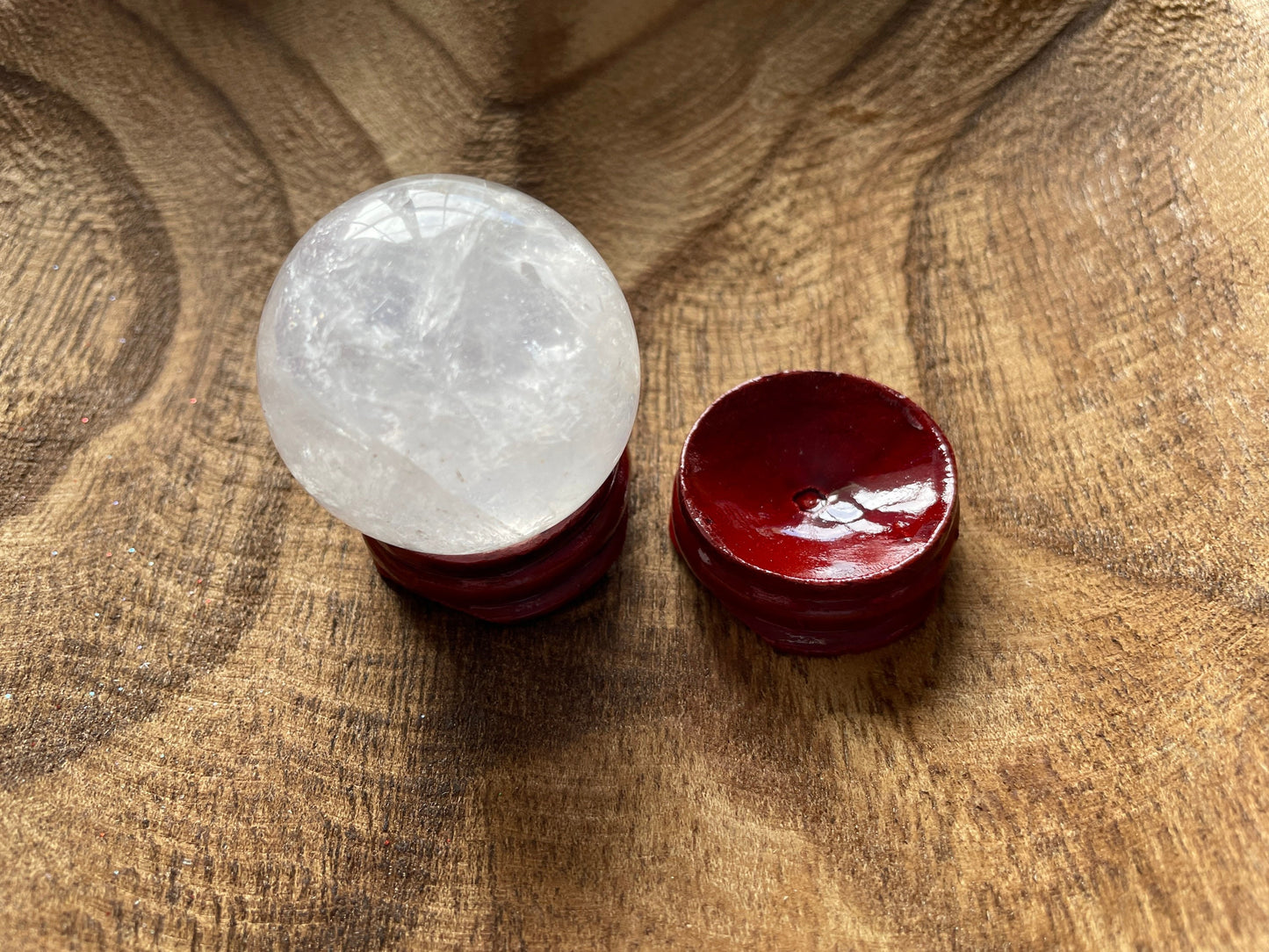 Crystal Clear Quartz crystal ball/sphere is 3.2 oz with the wooden stand.