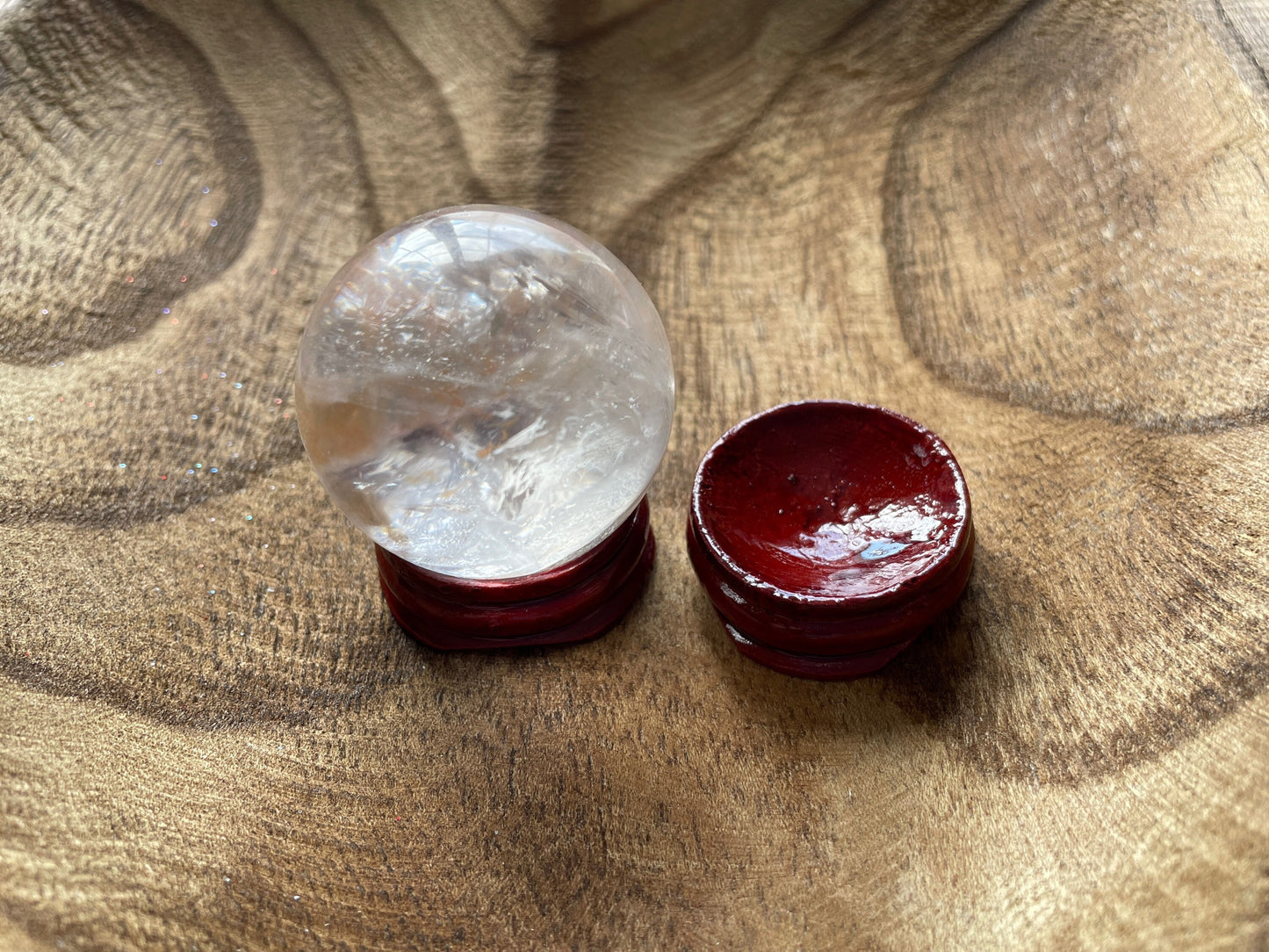 Crystal Clear Quartz crystal ball/sphere is 3.4 oz with the wooden stand.