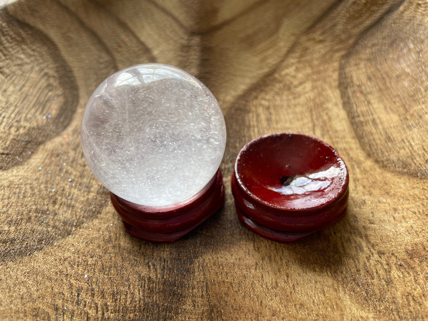 Crystal Clear Quartz crystal ball/sphere is 2.7 oz with the wooden stand.