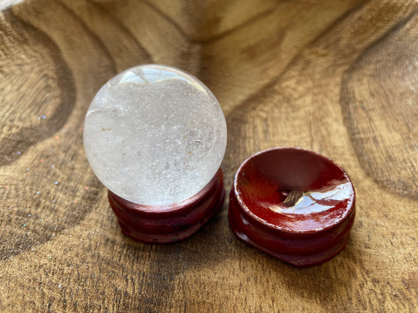 Crystal Clear Quartz crystal ball/sphere is 2.5 oz with the wooden stand.