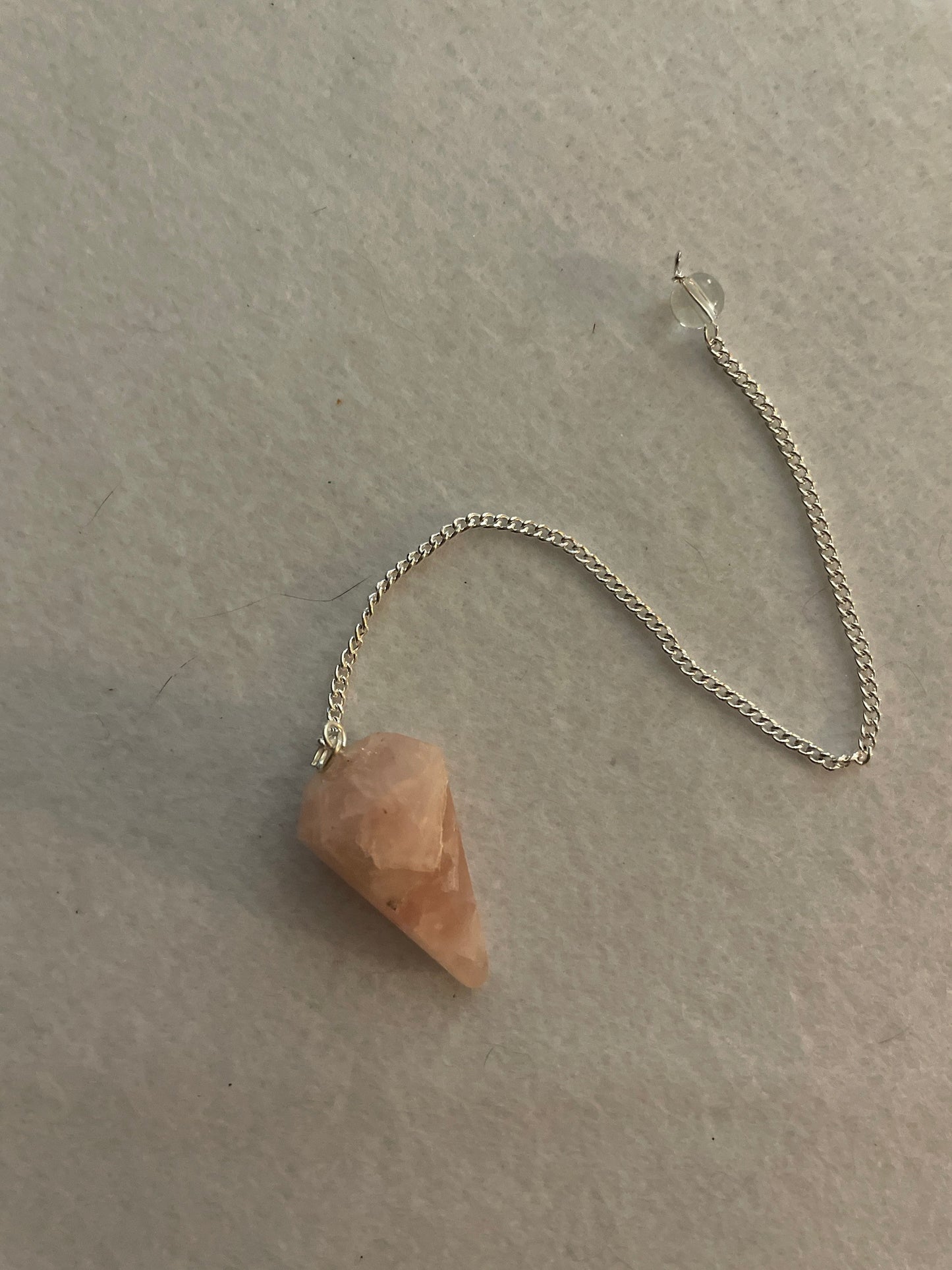 This beautiful Rose Quartz Pendulum is  1.35” and with chain is 8”