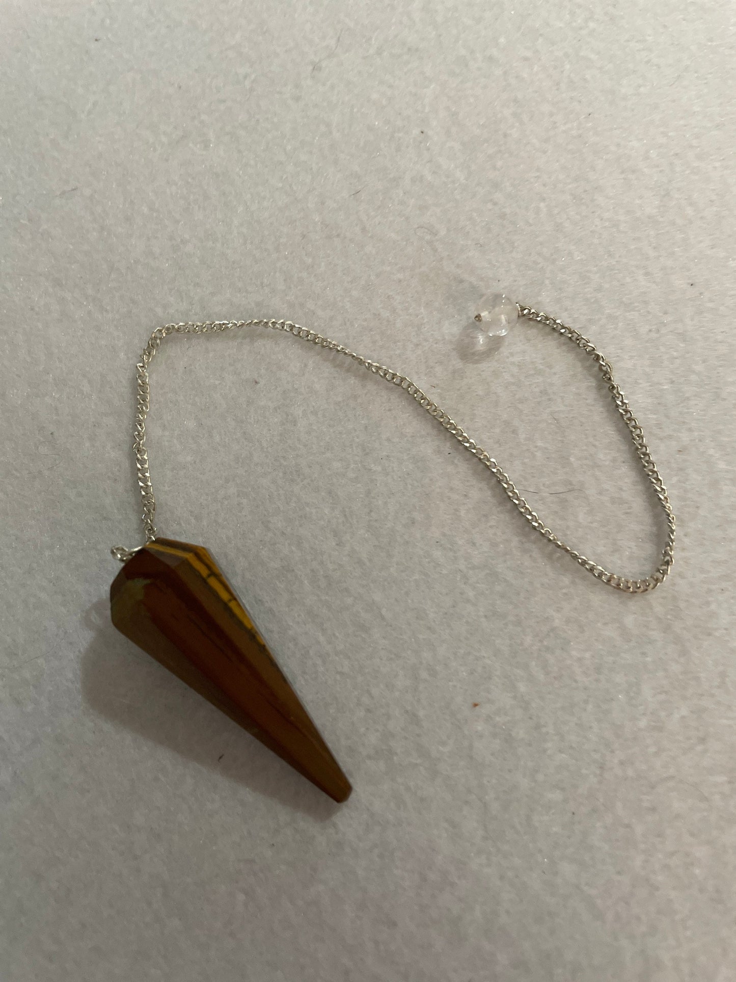 Beautiful Tiger’s Eye pendulum ornaments perfect for dowsing. Hang it in a well lit window, from the ceiling or on the wall!