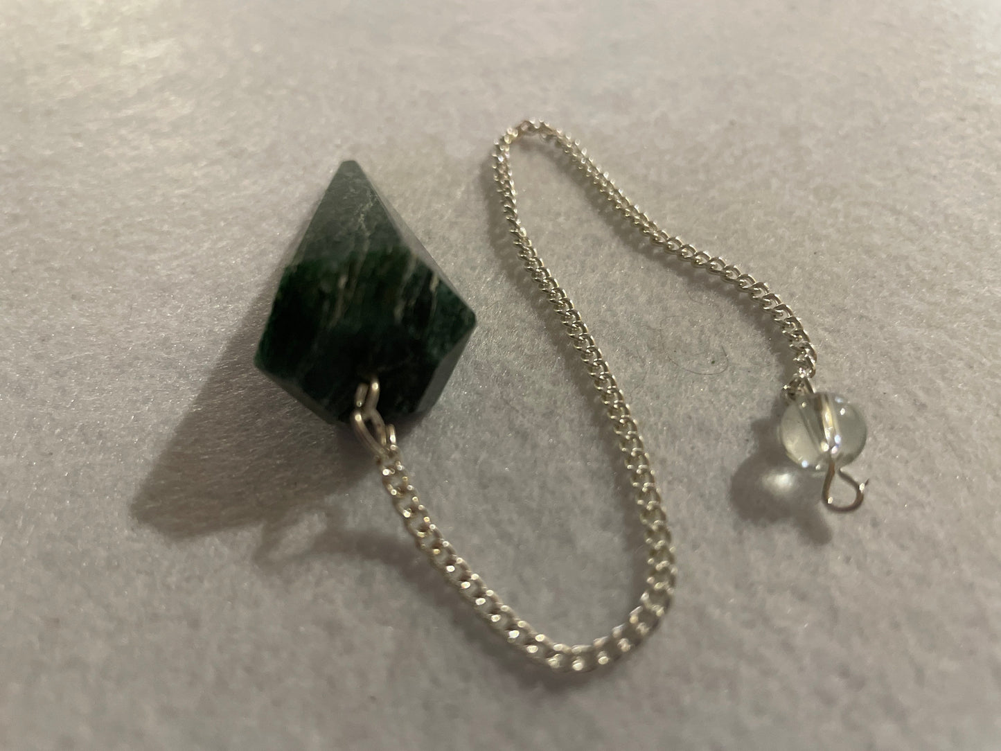 Jade Pendulum is  1.75” and with chain is 8.5”