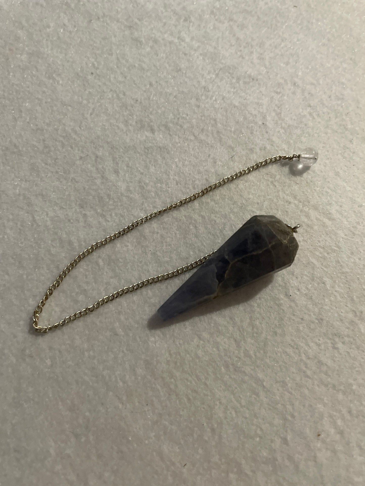 Pretty Blue Chalcedony pendulum is approximately 1.75” and with chain is 9” total length