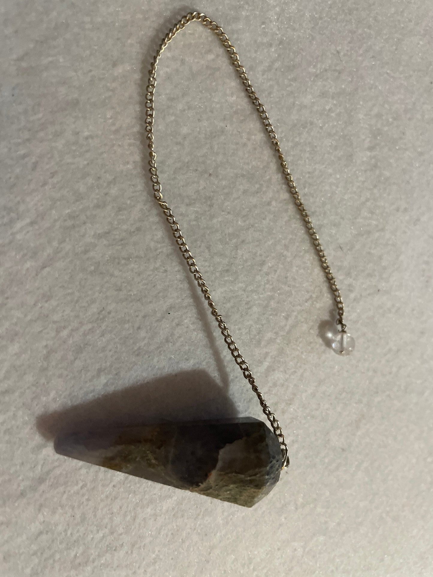 Pretty Blue Chalcedony pendulum is approximately 1.75” and with chain is 9” total length