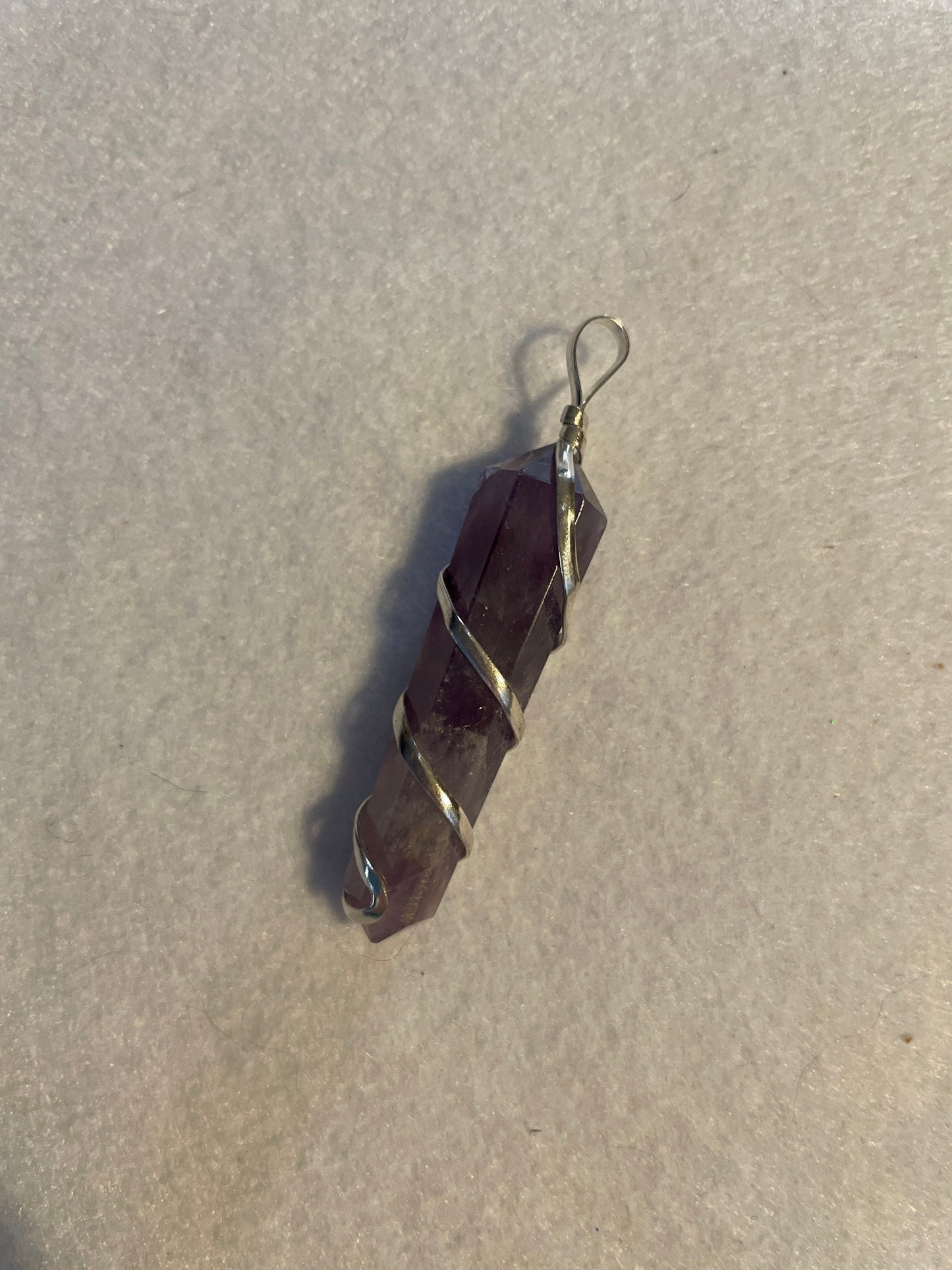 Gorgeous Amethyst point Pendant is almost 2” and is wrapped in precious silver.