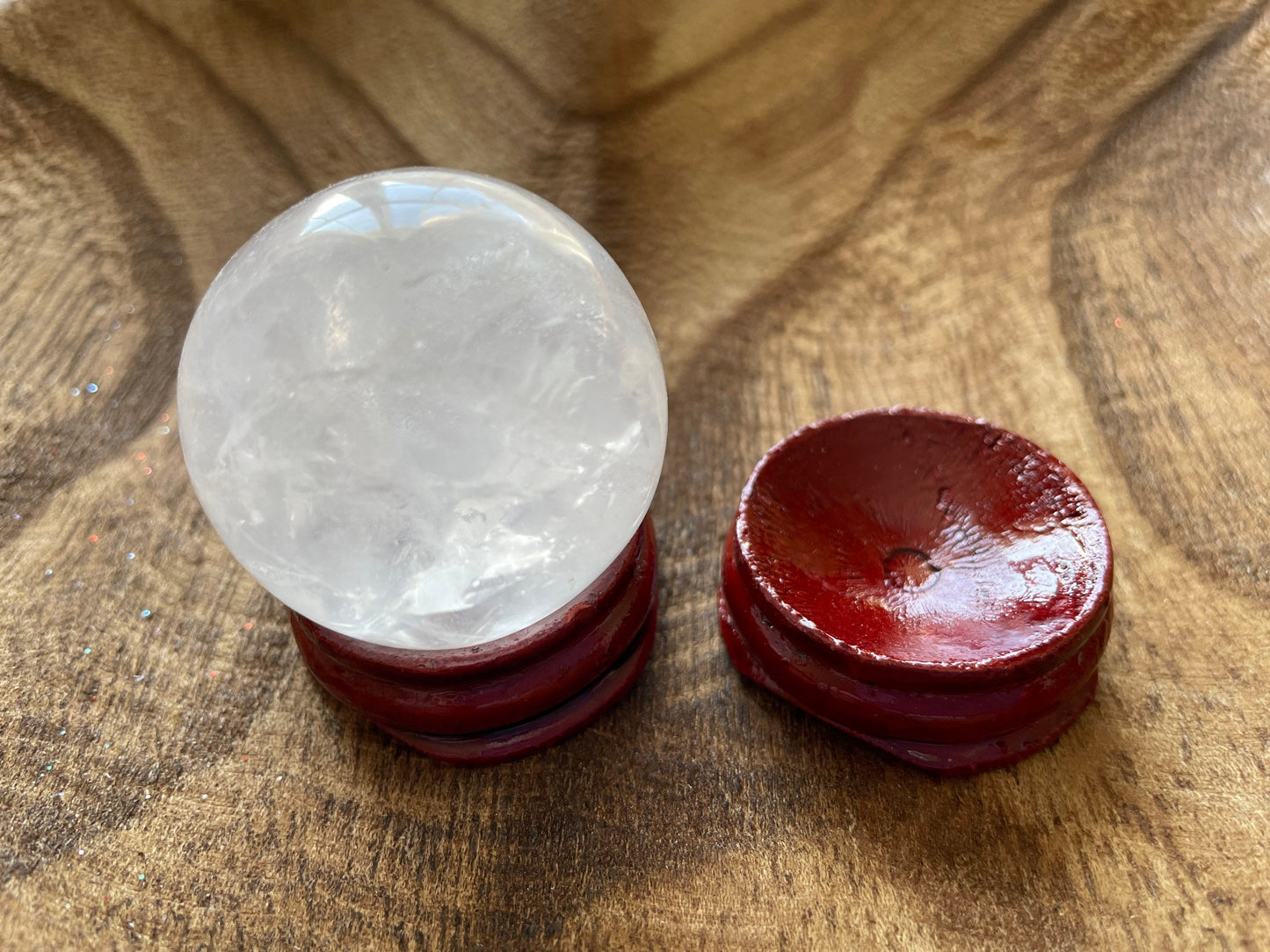 Crystal Clear Quartz crystal ball/sphere is 2.8 oz with the wooden stand.