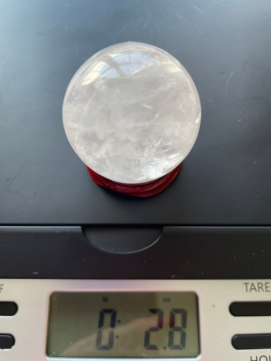 Crystal Clear Quartz crystal ball/sphere is 2.8 oz with the wooden stand.