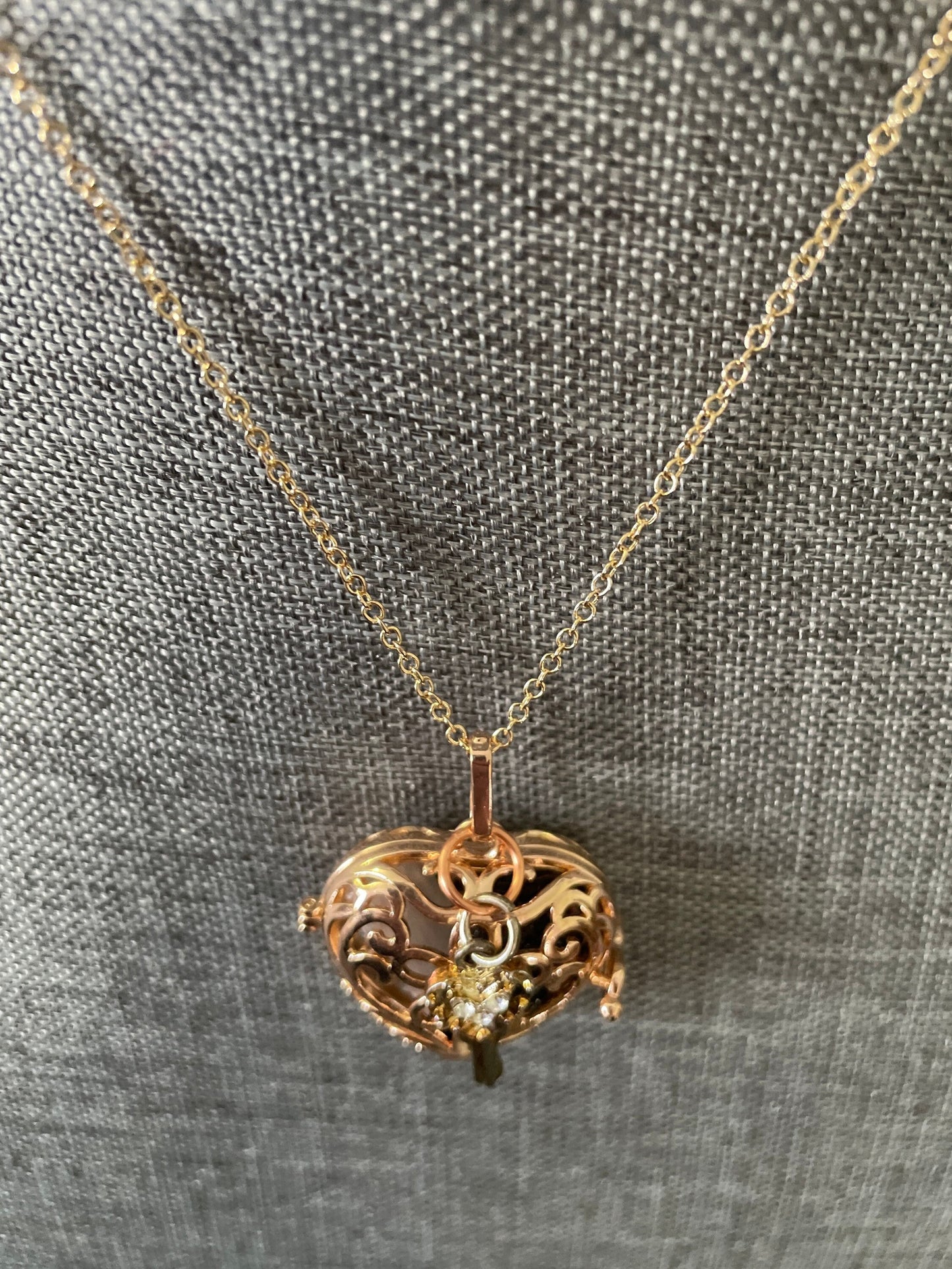 Gold locket filled with crystals on 16+” gold chain